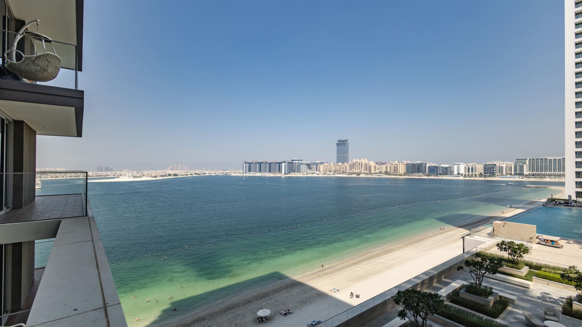 Modern living room in Beach Isle apartment, Emaar Beachfront, with stylish decor and ocean view
