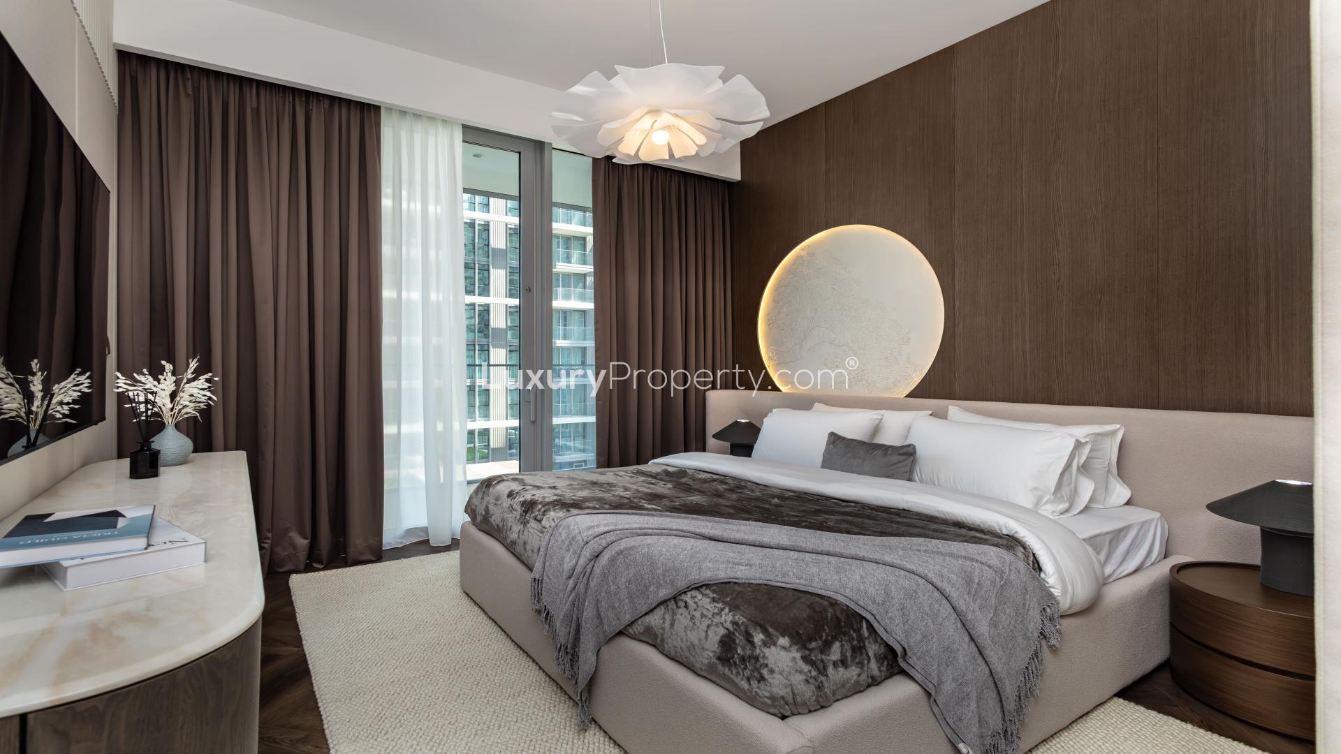 Beachfront apartment view in Emaar Beachfront, Beach Isle, showcasing ocean and city skyline