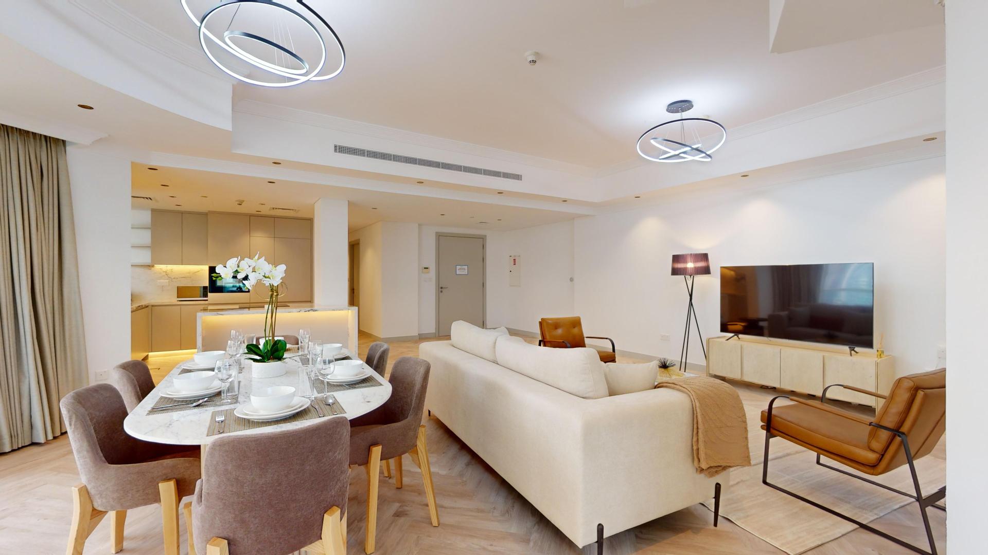 Luxurious open-plan living area in high-end renovated Dubai Marina apartment for sale