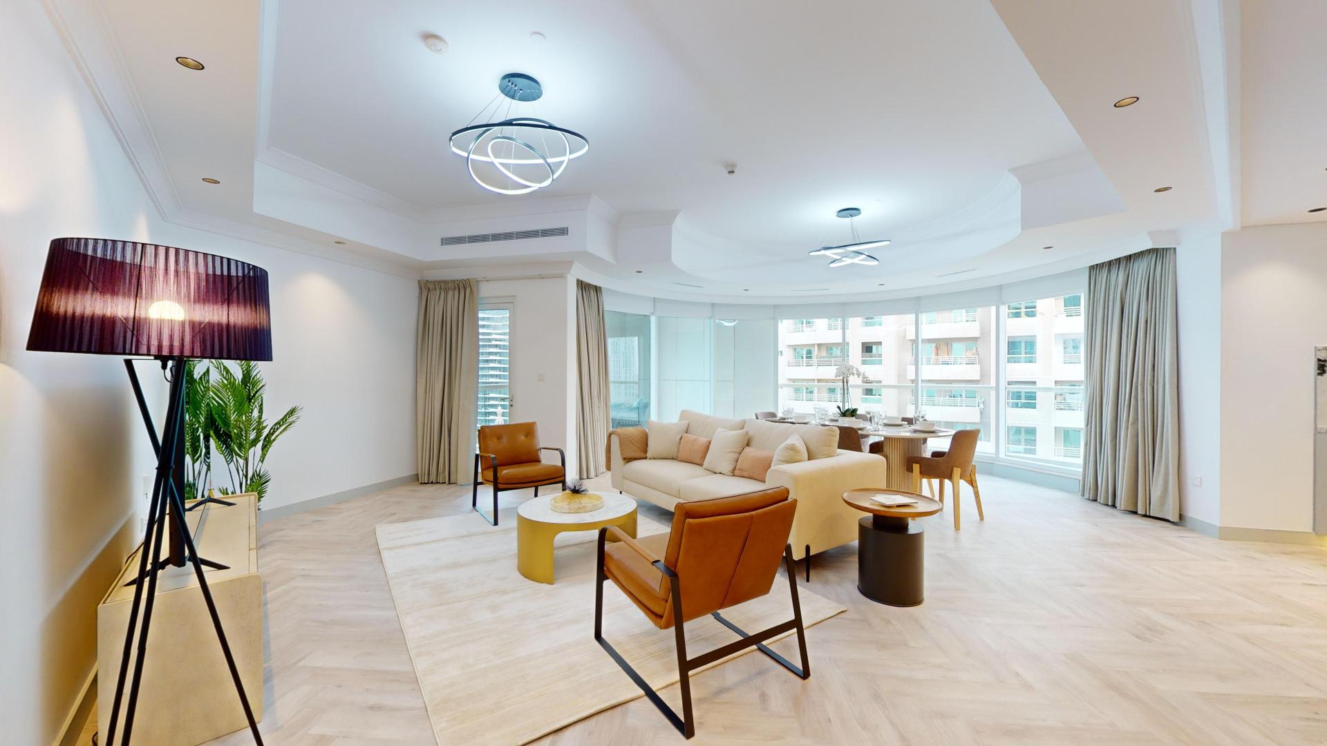 Luxurious living room and dining area in Dubai Marina apartment, Trident Waterfront
