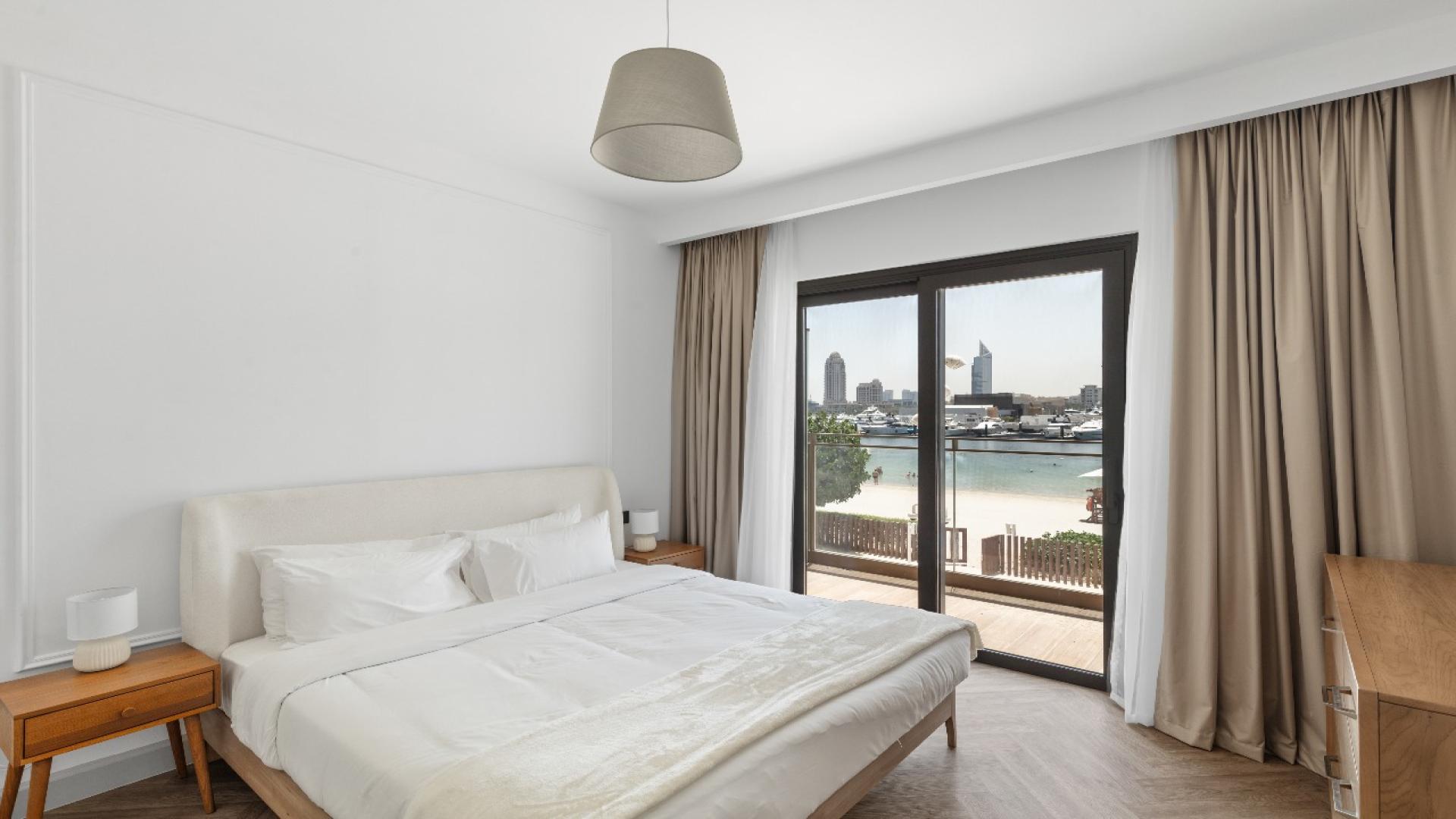 Modern kitchen in Marina Vista apartment, featuring dining area and sleek design elements