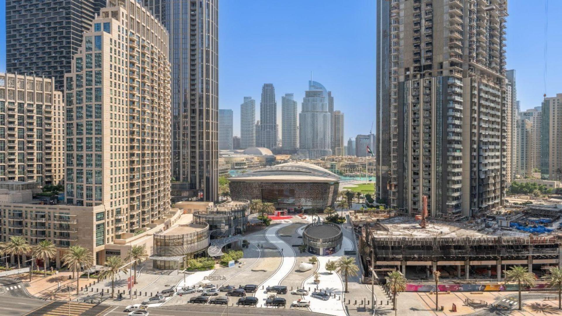 Modern living area in Forte apartment, Downtown, featuring open-plan kitchen and dining space