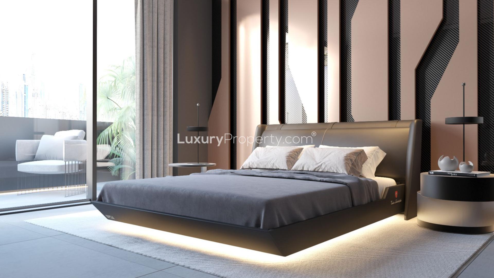 "Modern dining area in Tonino Lamborghini Residences, Nad Al Sheba First apartment for sale.",Luxurious bedroom in Tonino Lamborghini Residences, Nad Al Sheba First apartment for sale