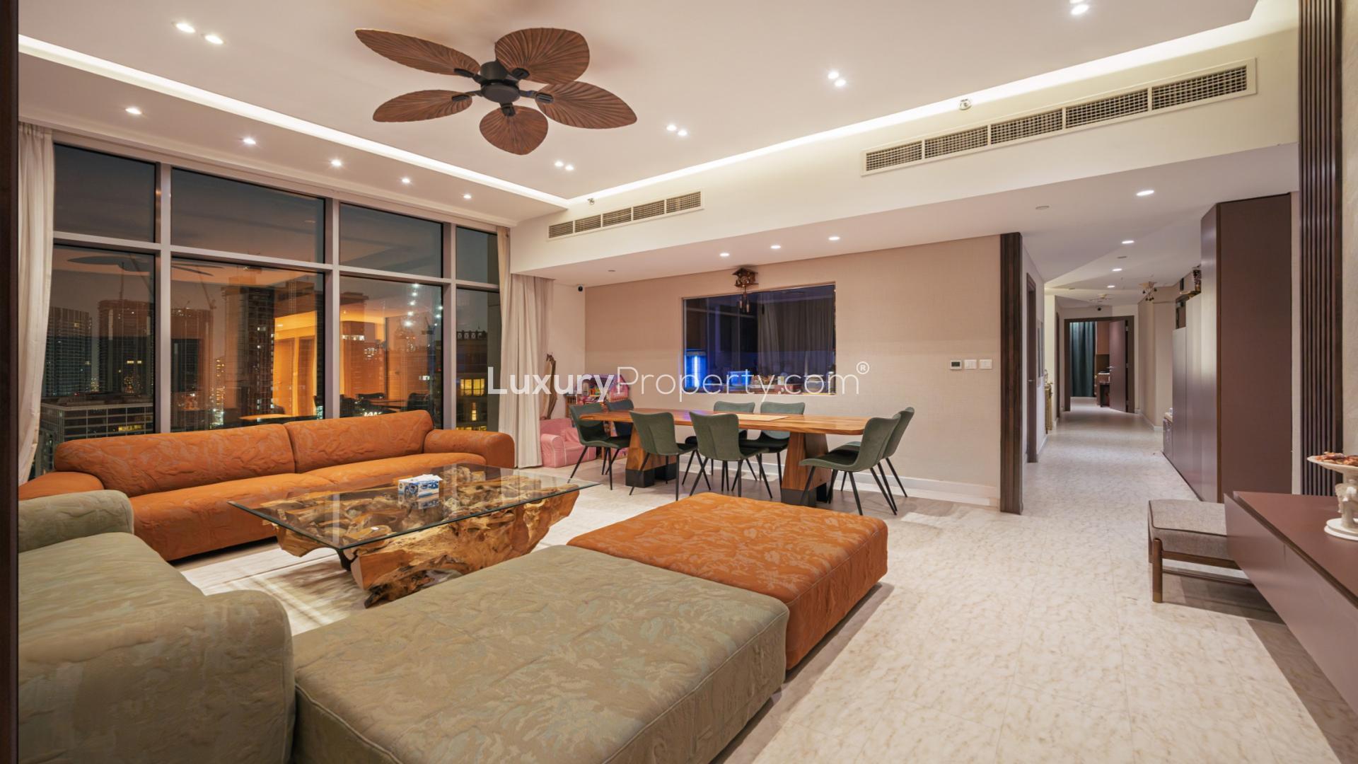 "Stunning balcony view from BLVD Crescent apartment in Downtown, 3-bedroom, 4-bathroom for sale.",Luxurious living room in Downtown BLVD Crescent apartment for sale, featuring modern decor