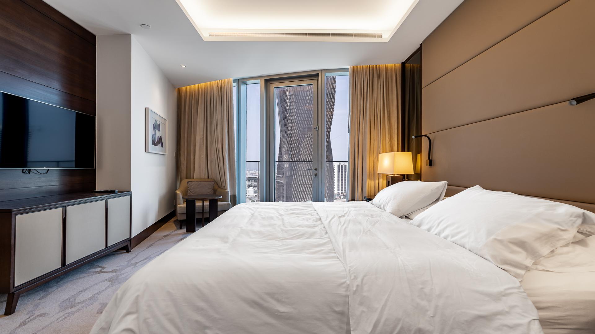 Luxurious bedroom in Address Residences Sky View apartment, Downtown Dubai, featuring modern furnishings