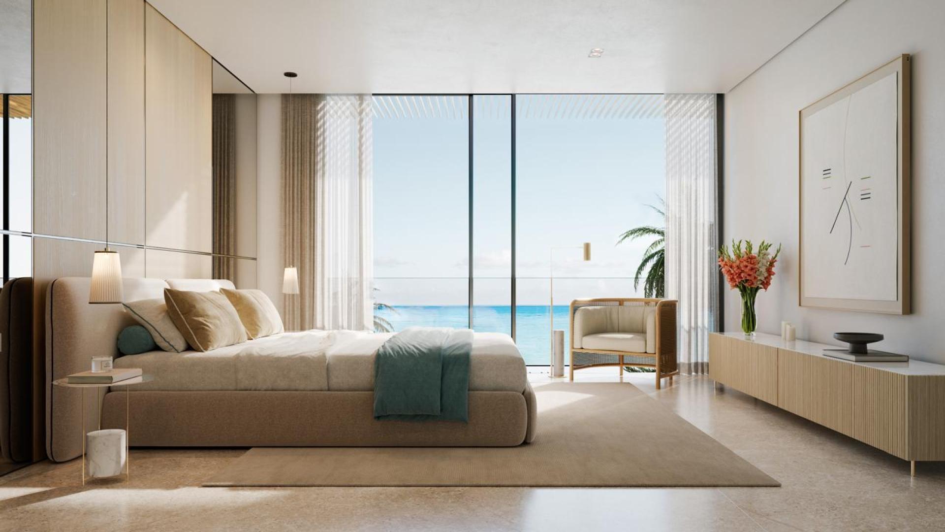 Modern living room with sea view in Dubai Islands apartment for sale, Rixos community