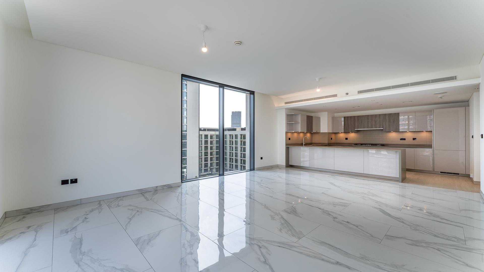 Modern open-plan living space in Sobha Hartland's Crest Grande apartment for sale