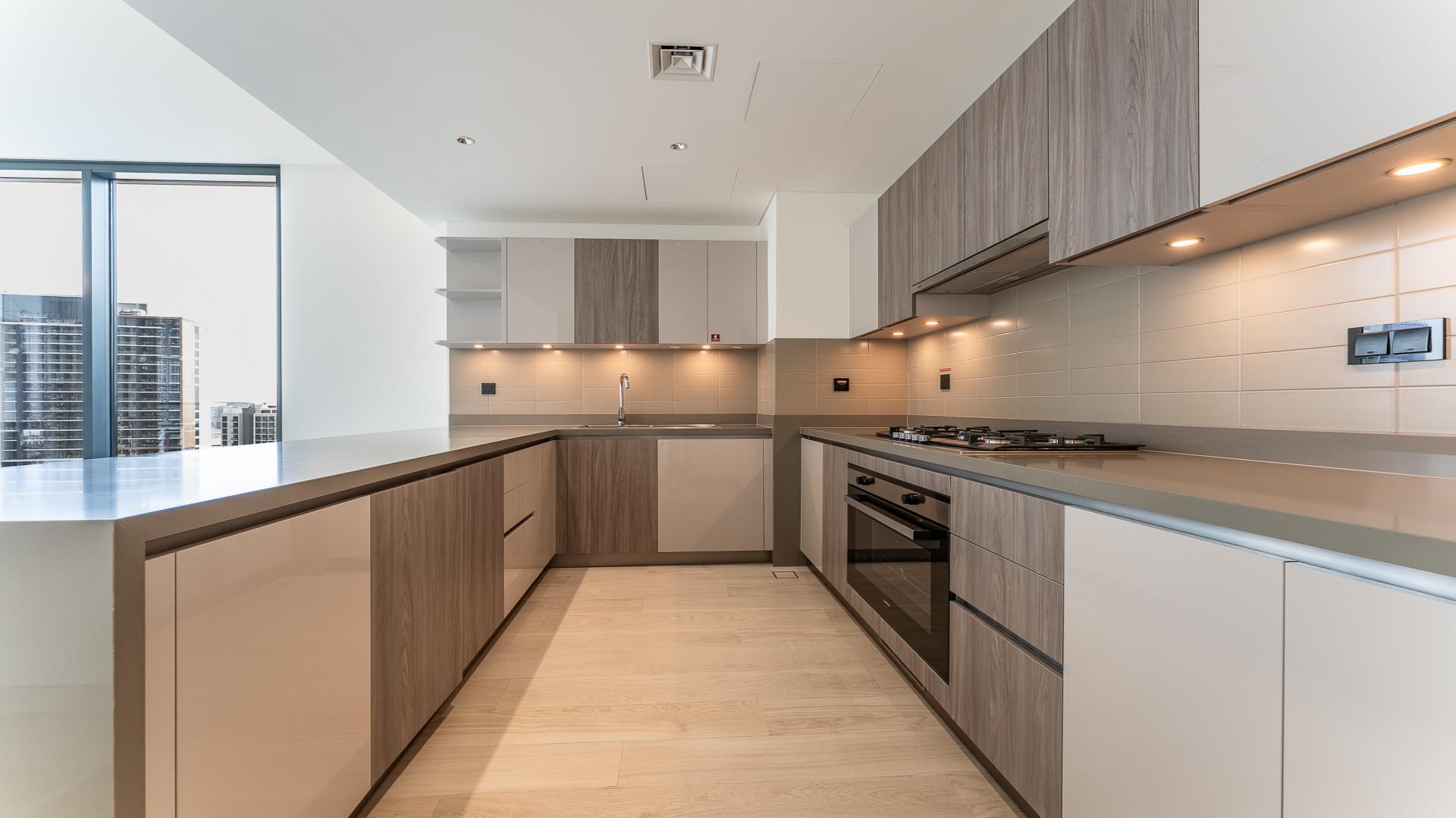 Modern kitchen with sleek cabinetry in Crest Grande apartment, Sobha Hartland, LP48834 for sale