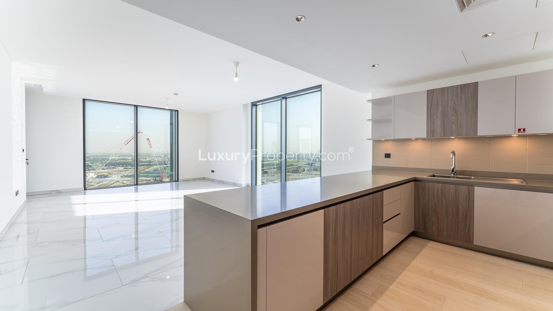 Bright open-plan kitchen and living area in Sobha Hartland Crest Grande apartment