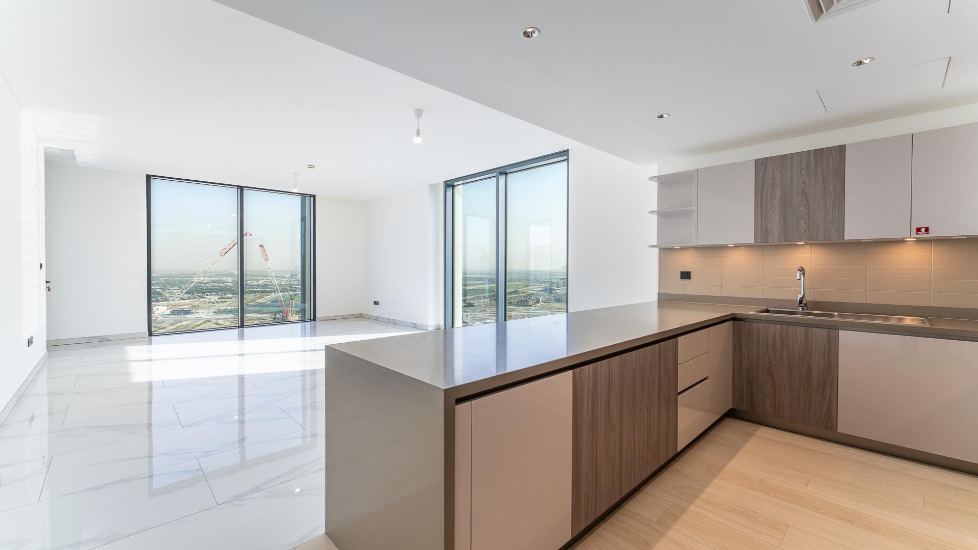 Bright open-plan kitchen and living area in Sobha Hartland Crest Grande apartment