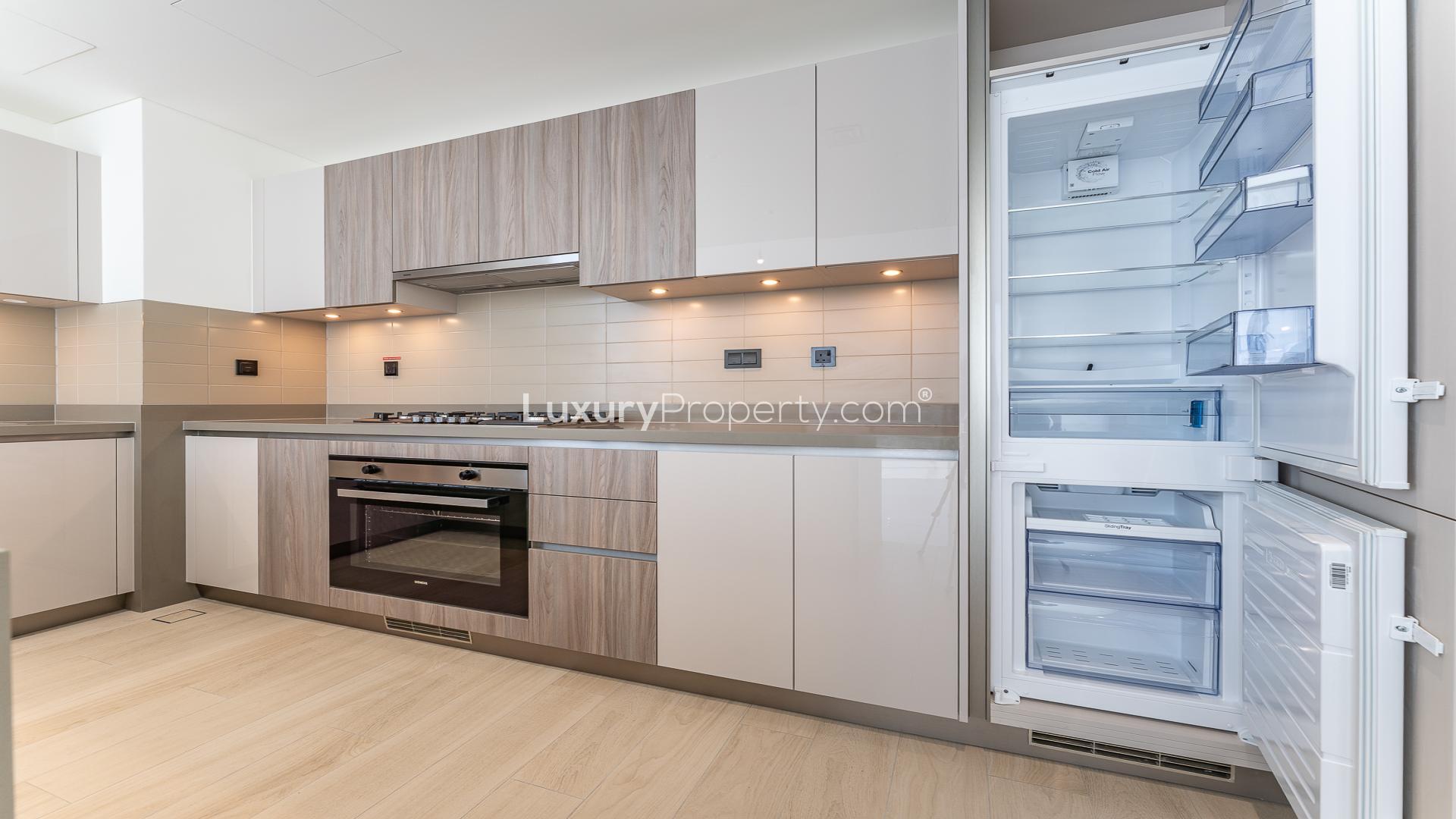 Modern kitchen interior in Crest Grande apartment, Sobha Hartland, LP48835, featuring sleek cabinetry