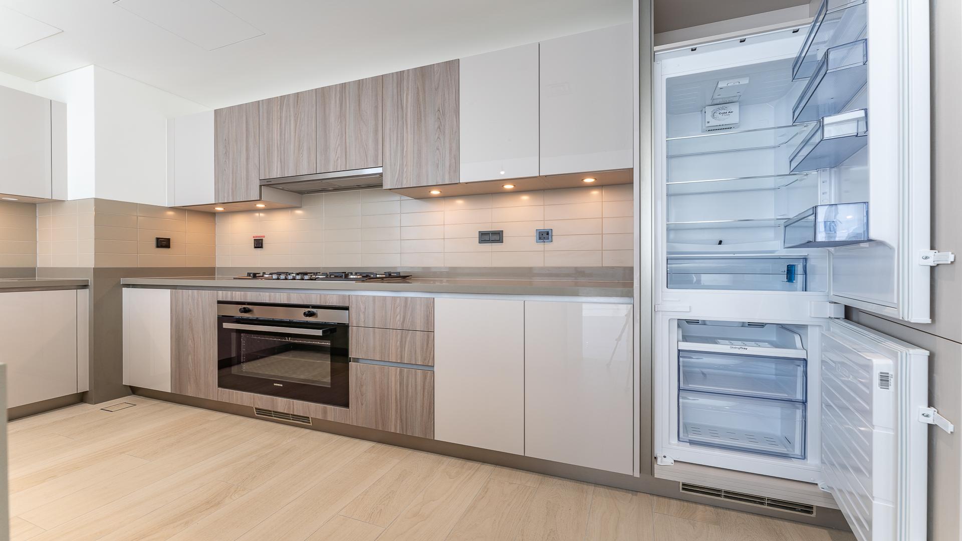 Modern kitchen interior in Crest Grande apartment, Sobha Hartland, LP48835, featuring sleek cabinetry