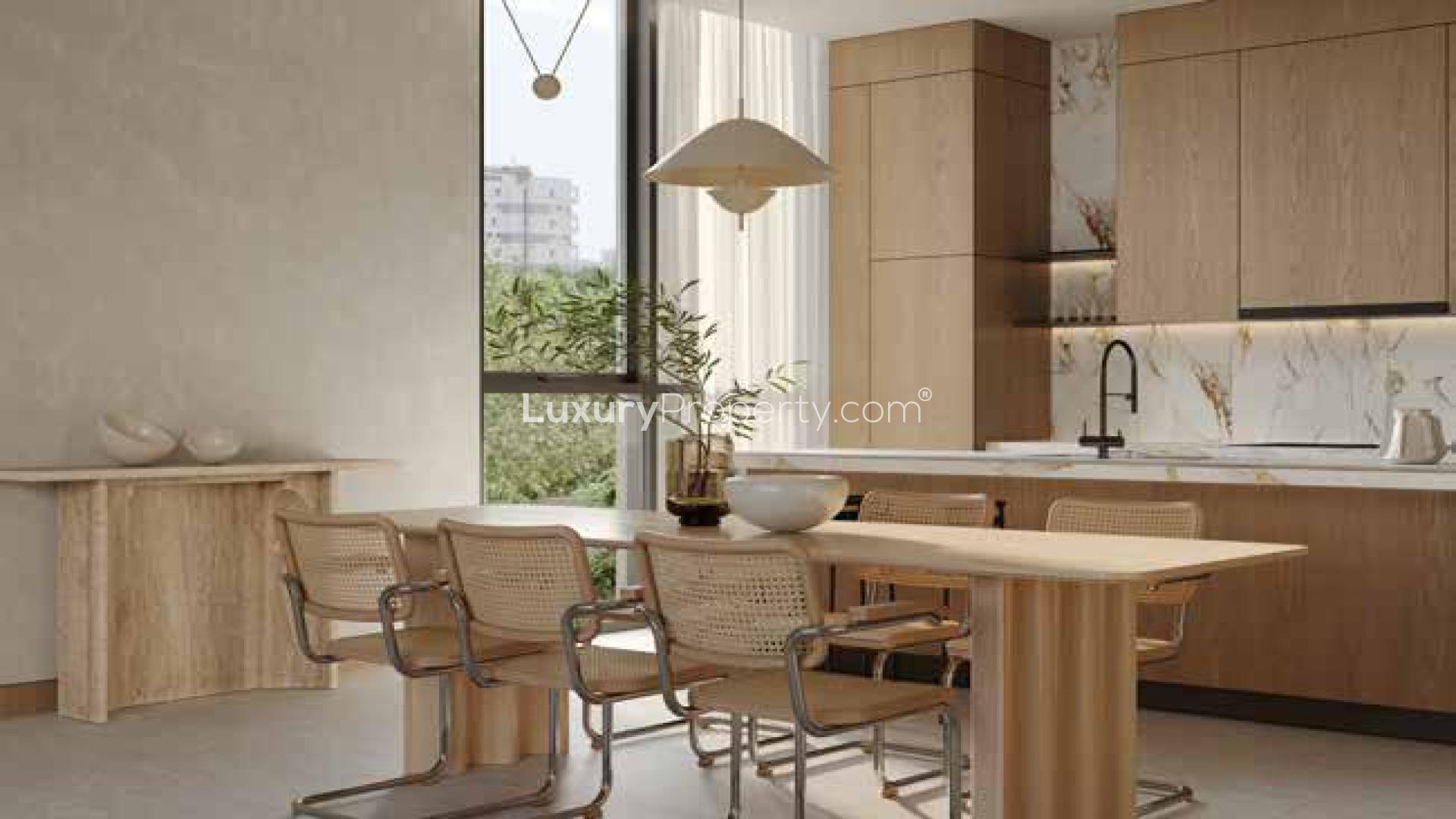 Modern living room in Al Barari apartment, featuring elegant furniture and large windows