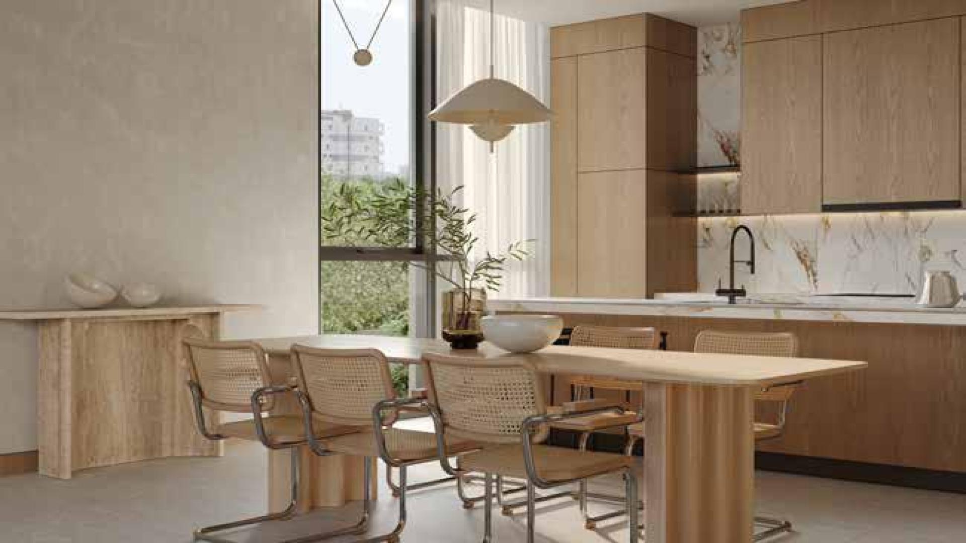 Modern living room in Al Barari apartment, featuring elegant furniture and large windows