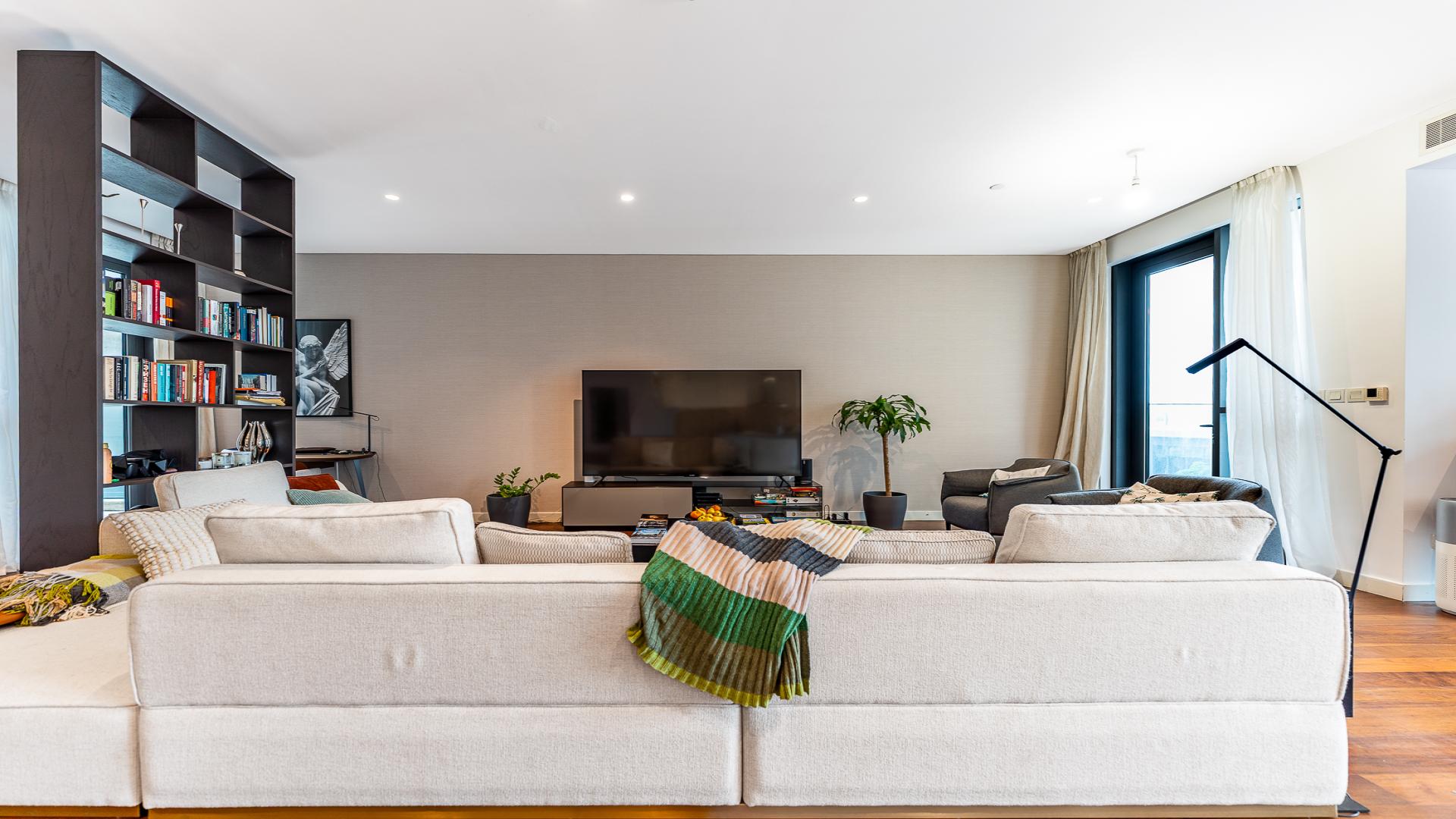 Modern living room and kitchen in City Walk apartment, Building 13B, for sale