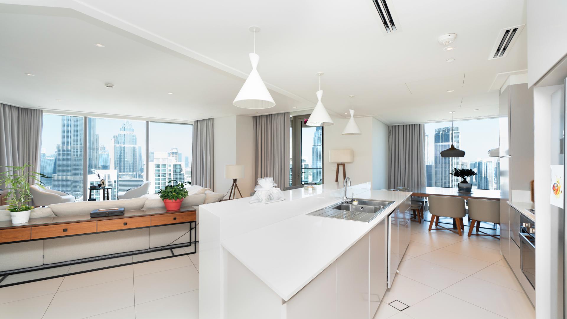 Modern living room in 3-bedroom apartment, Downtown Dubai, with Burj Khalifa views