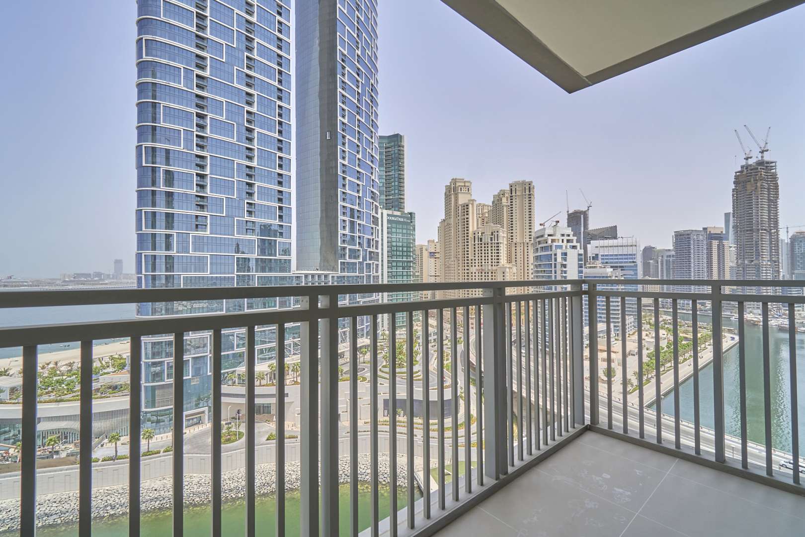 Balcony view from 3-bedroom apartment at 52|42, Dubai Marina, overlooking waterfront and skyline