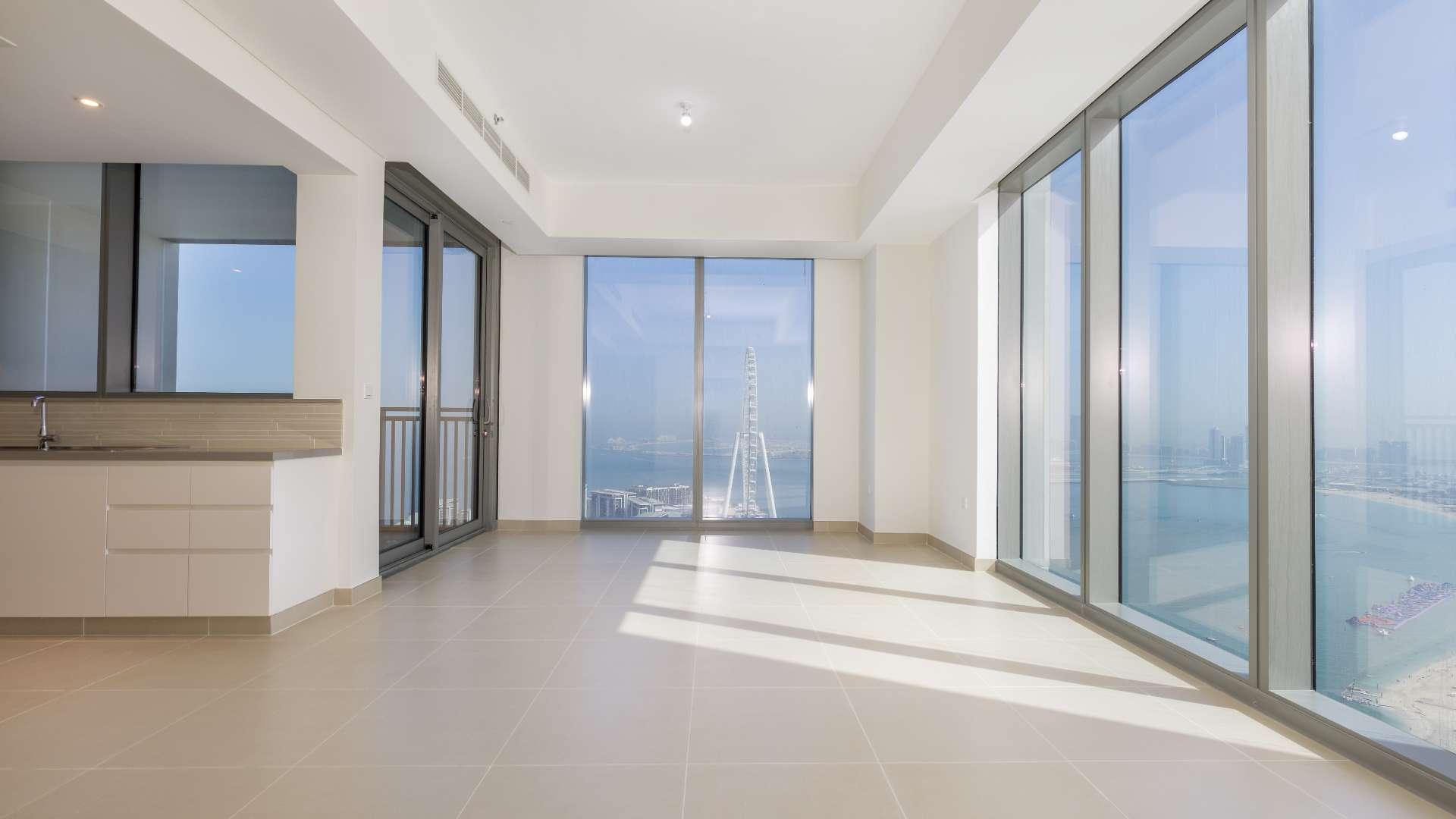 Aerial view of Dubai Marina beach and skyline near 5242 community apartment for rent