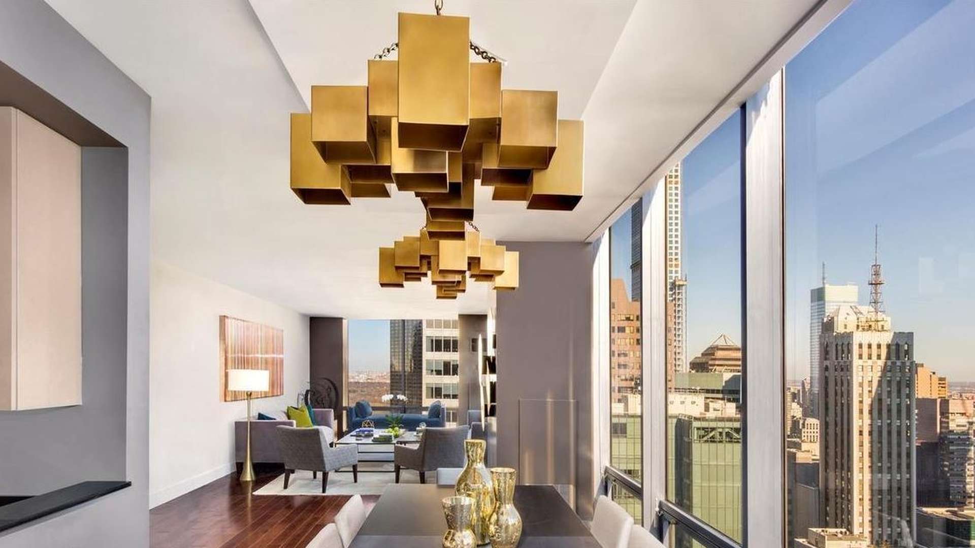 Luxurious Manhattan apartment dining area with city views, modern decor, and hardwood floors