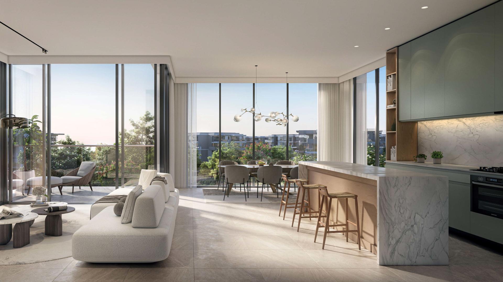 Luxurious apartment balcony view over lush greenery and Dubai skyline in Ghaf Woods