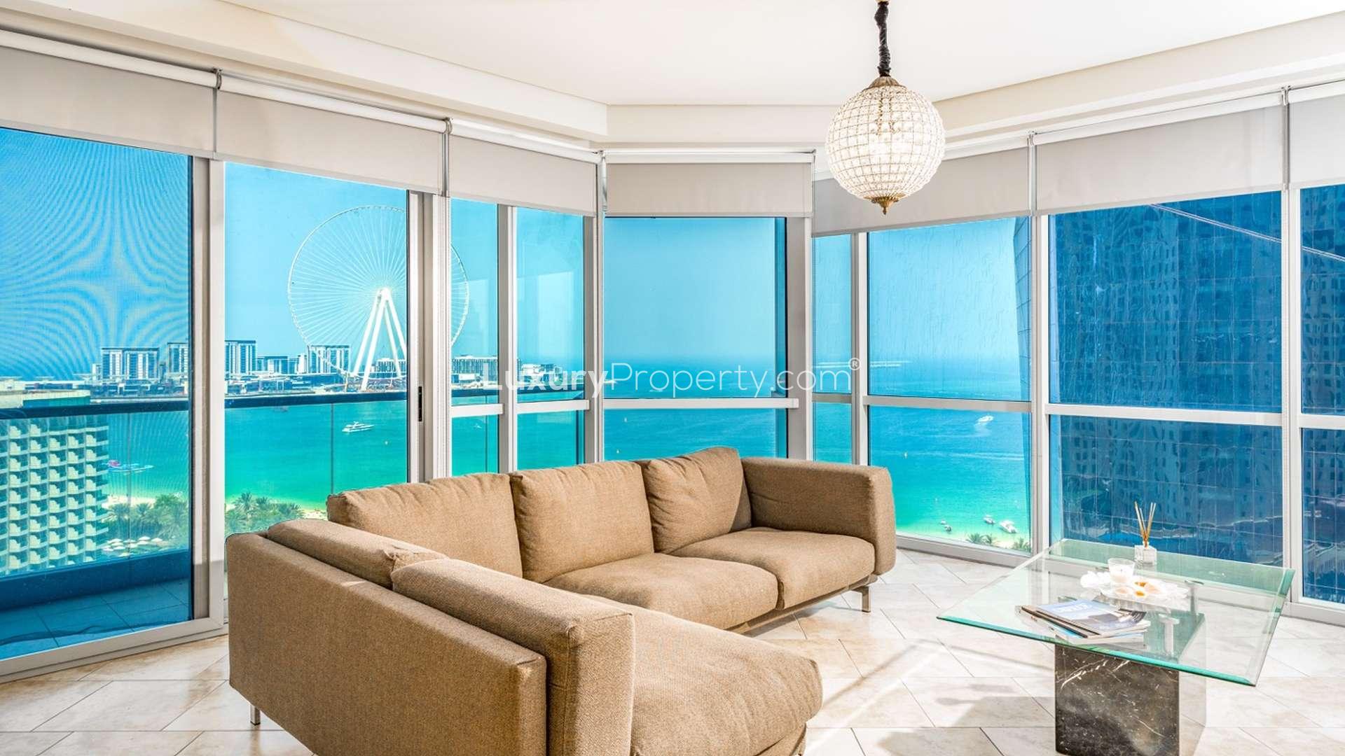"View of Al Fattan Marine Towers, JBR, featuring spacious three-bedroom apartment for sale.",Modern living room with sea view in Al Fattan Marine Towers, Jumeirah Beach Residence
