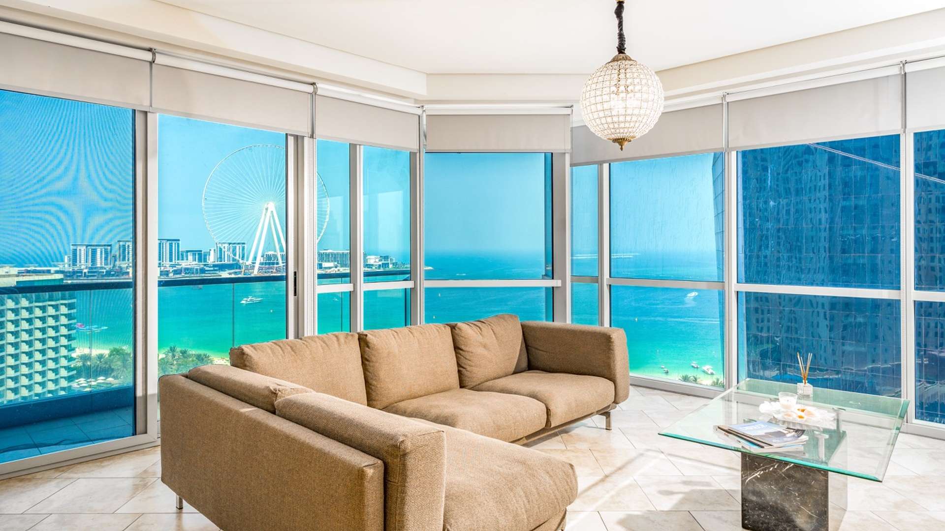 "View of Al Fattan Marine Towers, JBR, featuring spacious three-bedroom apartment for sale.",Modern living room with sea view in Al Fattan Marine Towers, Jumeirah Beach Residence