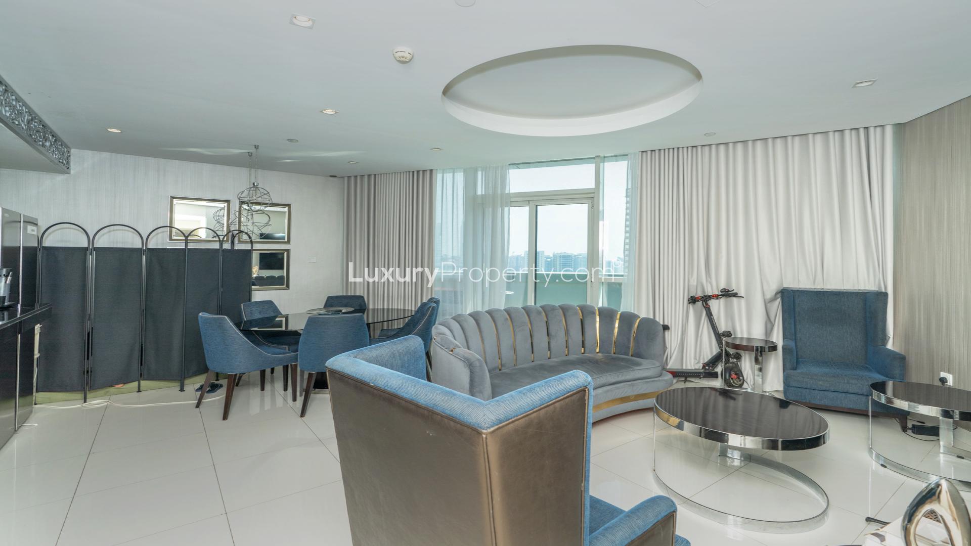 Modern bedroom with large bed and balcony view in Damac Maison, Downtown Dubai apartment