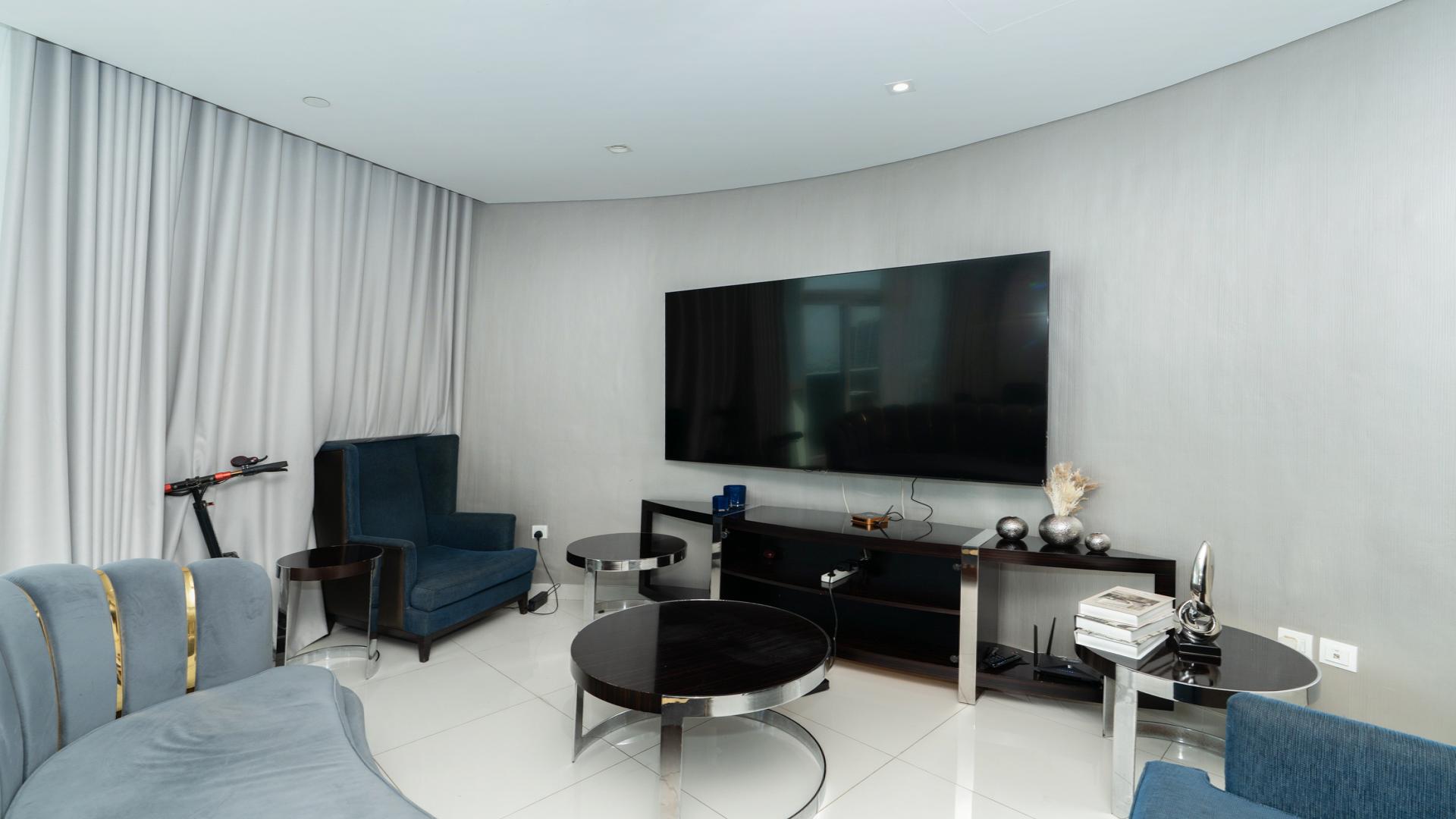 Balcony view from modern apartment in Damac Maison, Downtown Dubai, overlooking city skyline