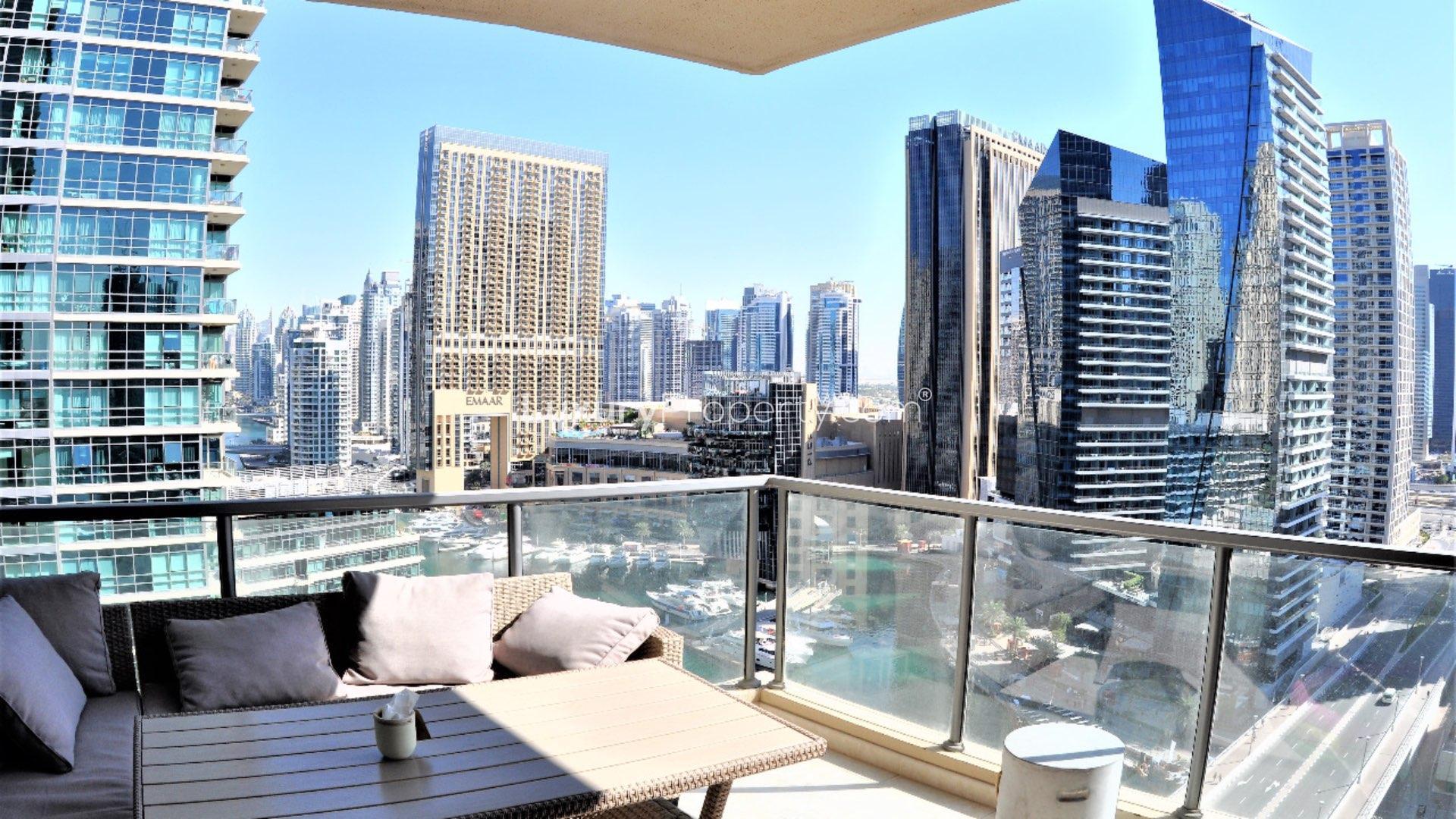 Stunning view of Dubai Marina from Al Sahab apartment balcony, showcasing skyscrapers and yachts