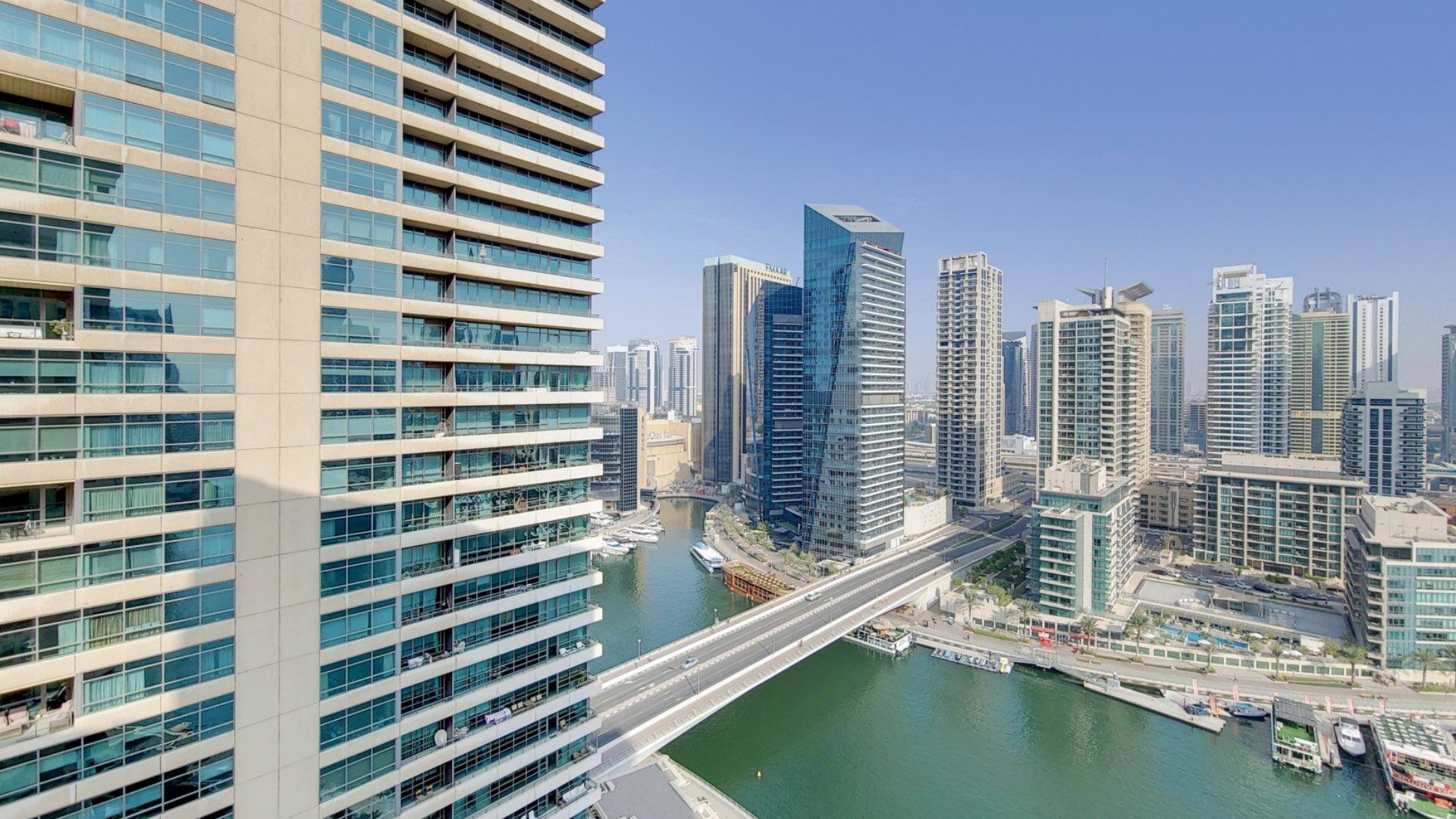 Luxurious living room with elegant furniture and marina view in Dubai Marina apartment