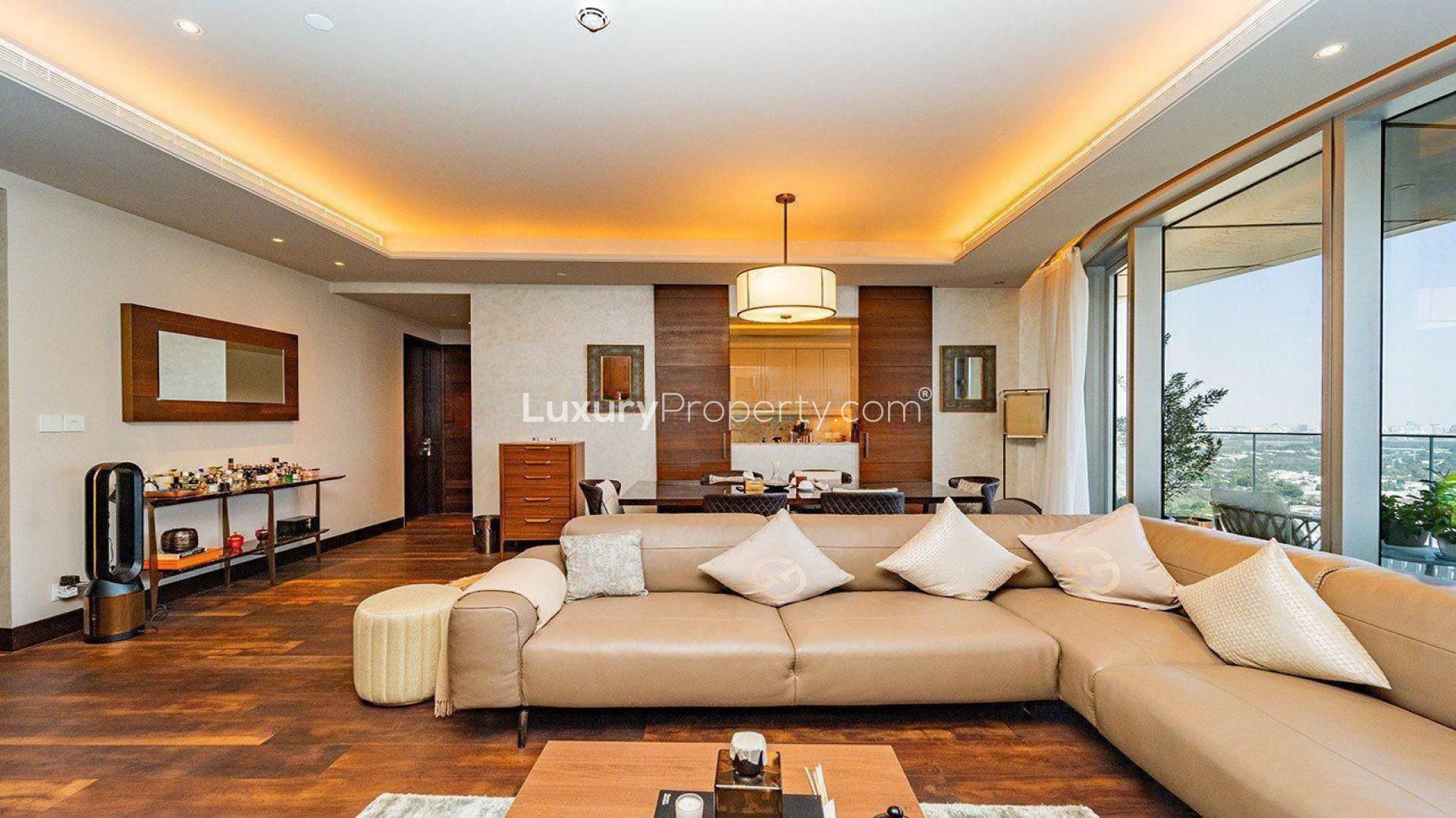 Stylish living room in 3-bed corner apartment, Downtown Dubai, city skyline views