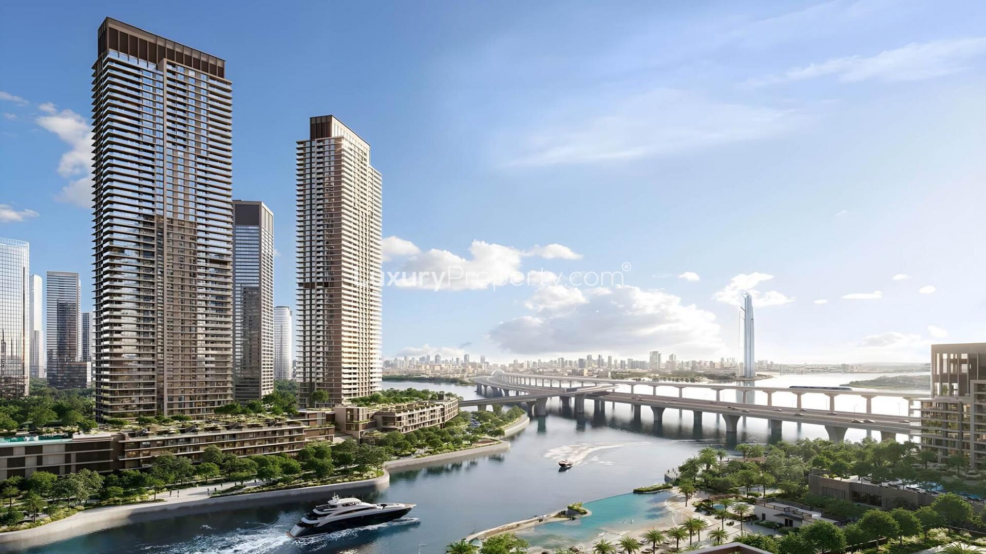 Luxury bedroom with balcony offering stunning views of Dubai Creek Harbour apartments