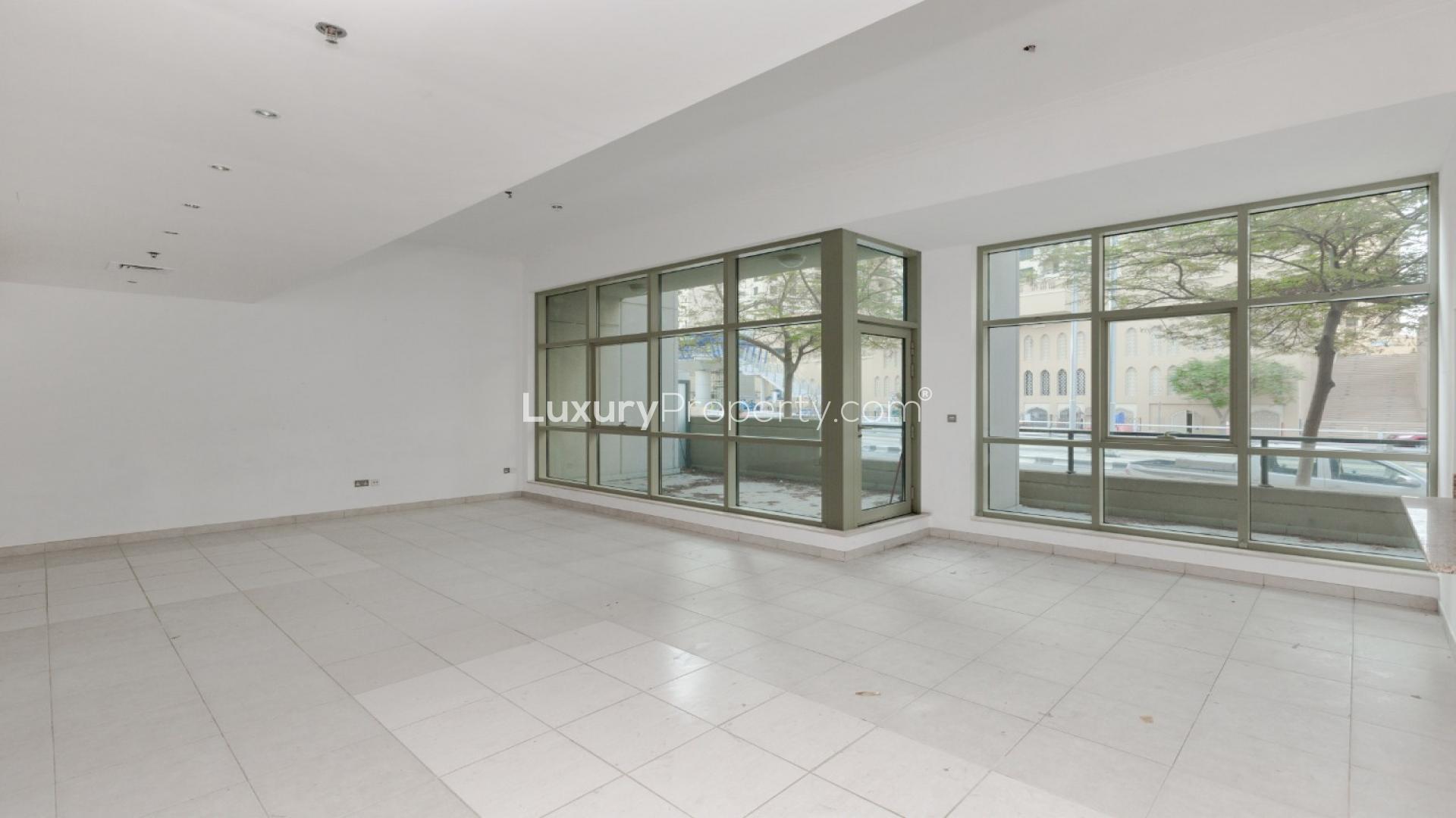 Open-plan living area with staircase in Marina Quays apartment, Dubai Marina