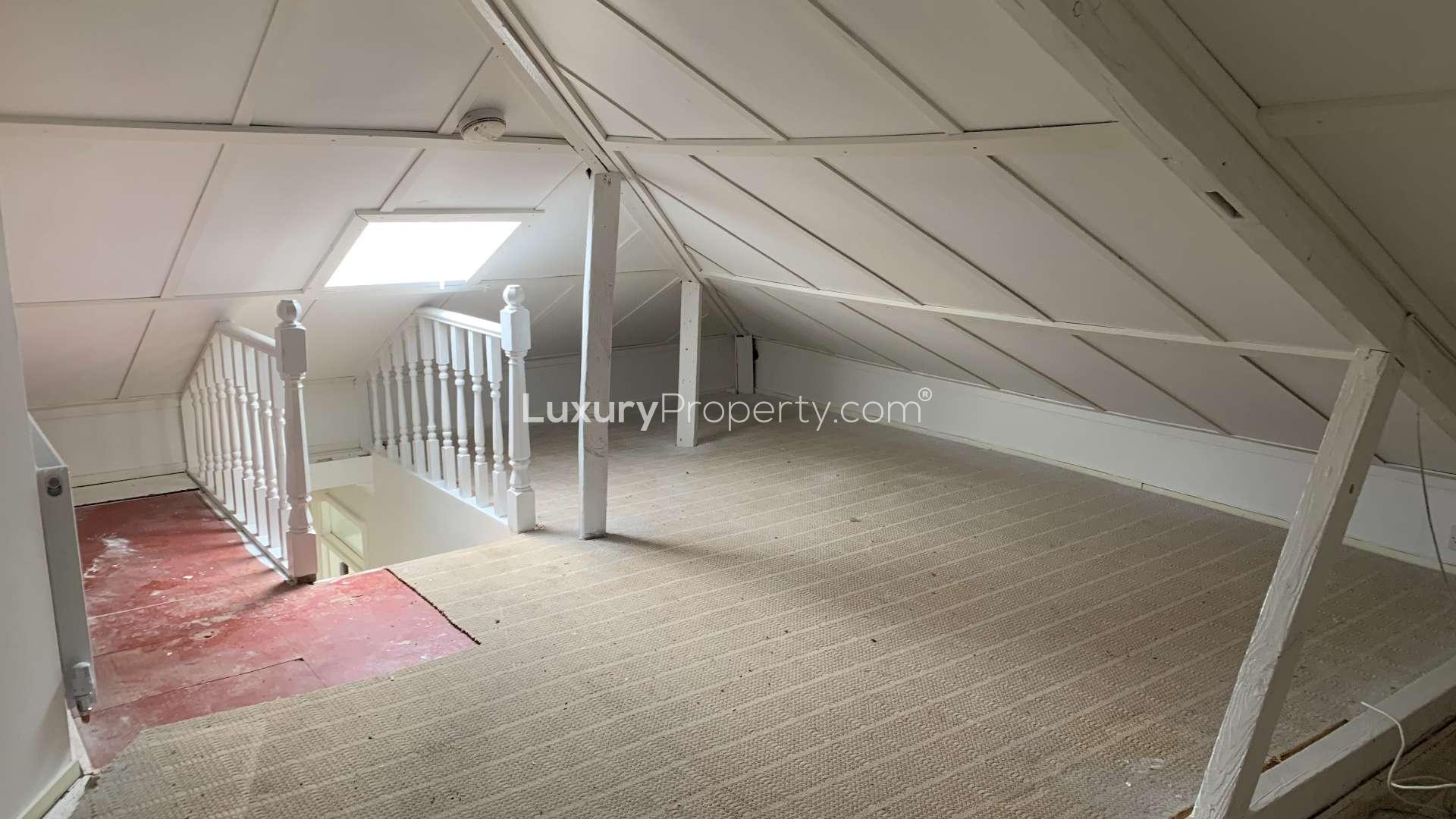 Bright bedroom with window view in Hilltop Court apartment, Alexandra Road, London