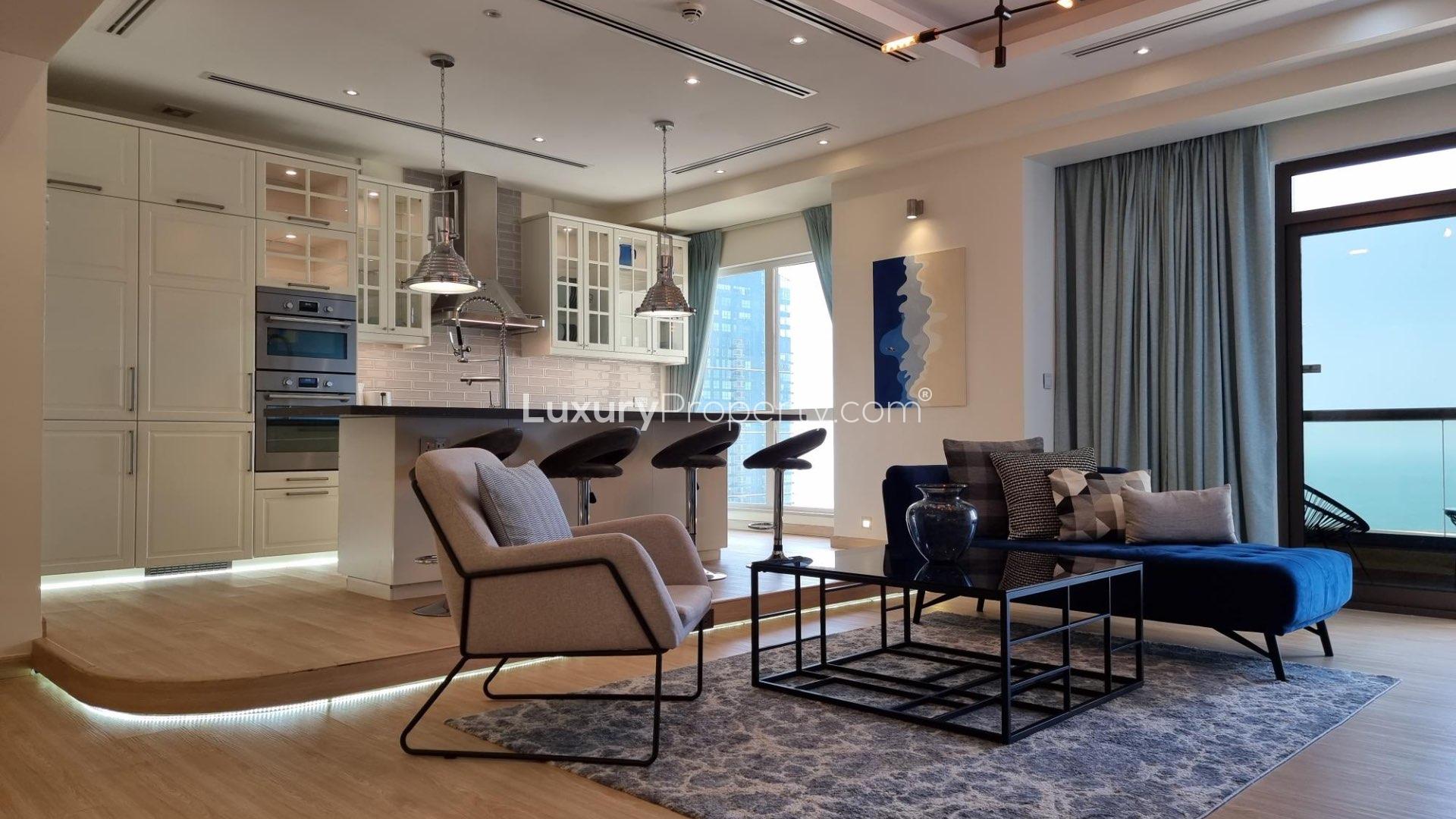 Laundry room in upgraded JBR apartment, featuring modern appliances and sleek cabinetry