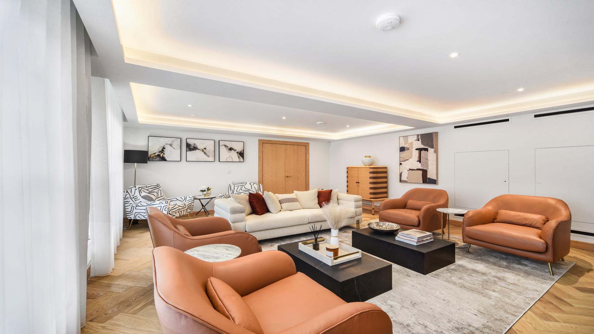 Modern living room in Marylebone duplex apartment for sale, featuring elegant furniture and decor