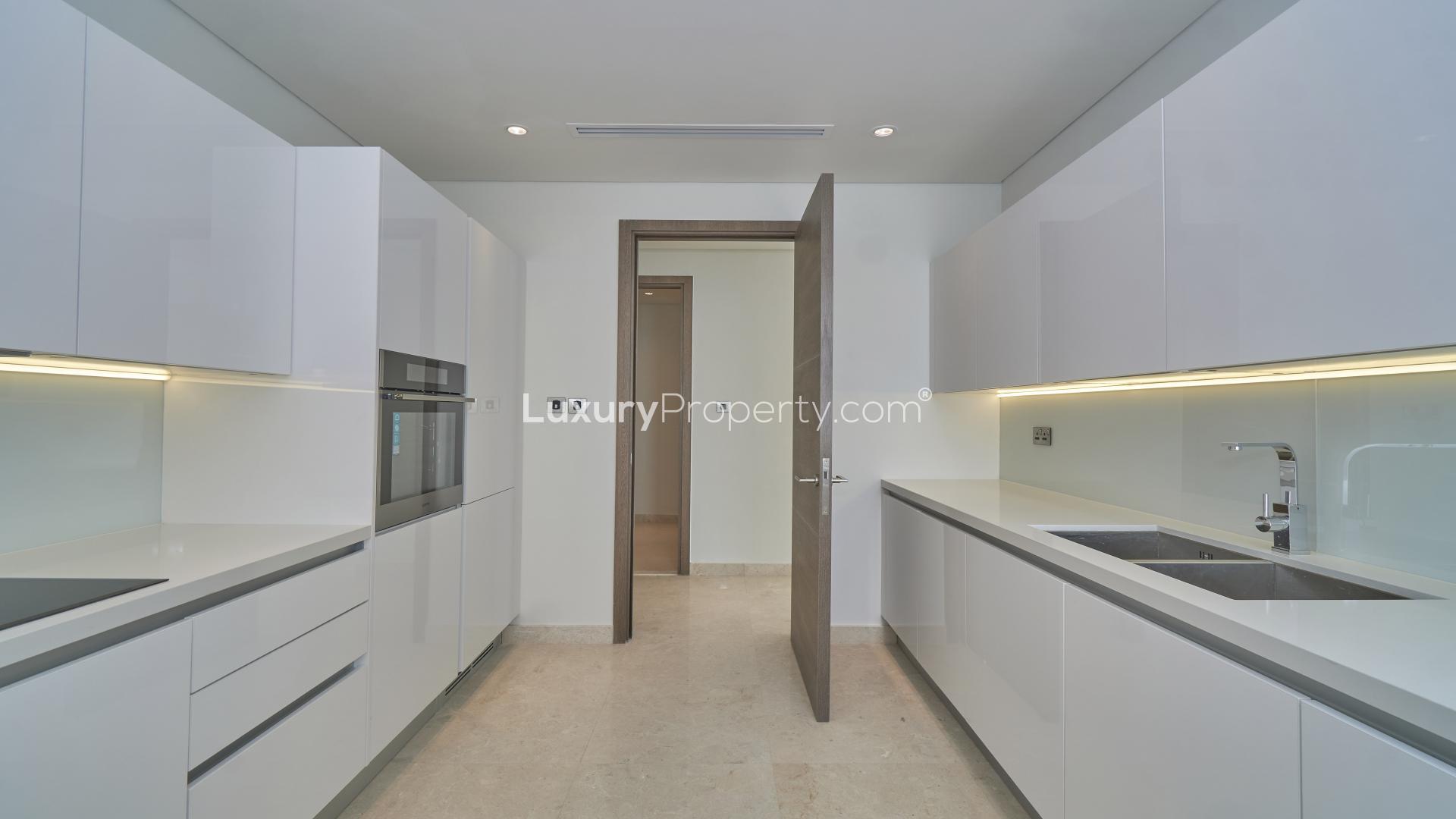 Modern kitchen in three-bedroom apartment for sale in Anwa, Maritime City