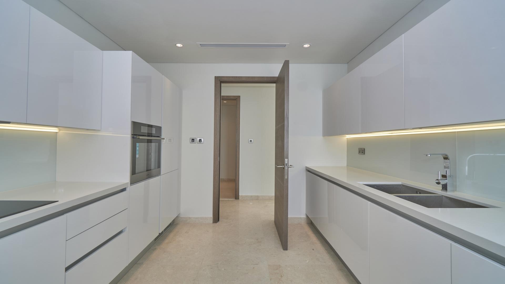 Modern kitchen in three-bedroom apartment for sale in Anwa, Maritime City