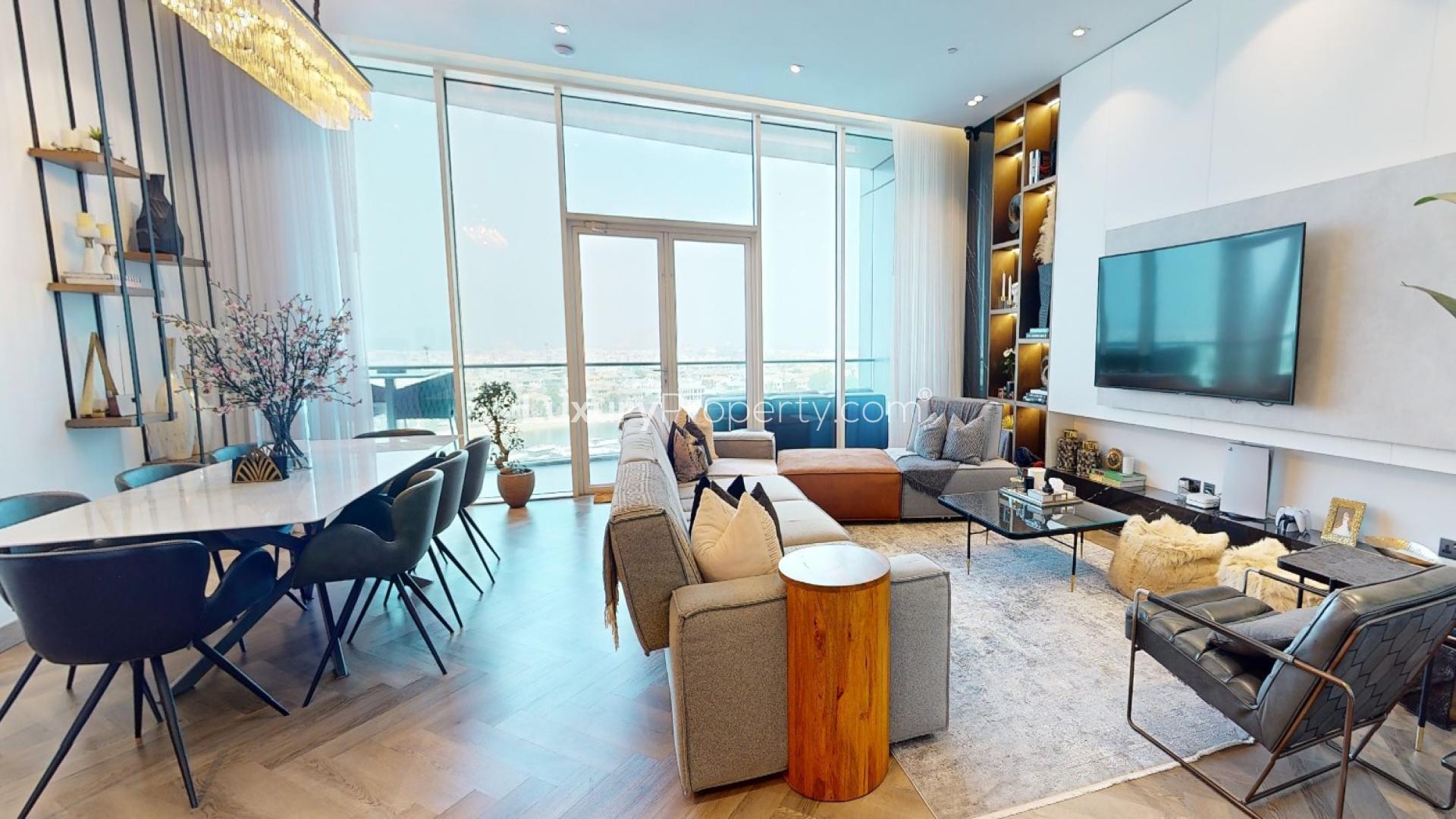 "Stunning marina view from luxury Oceana apartment, Palm Jumeirah, with yachts and clear skies.",Luxurious living room in Oceana apartment, Palm Jumeirah, with modern decor and sea view