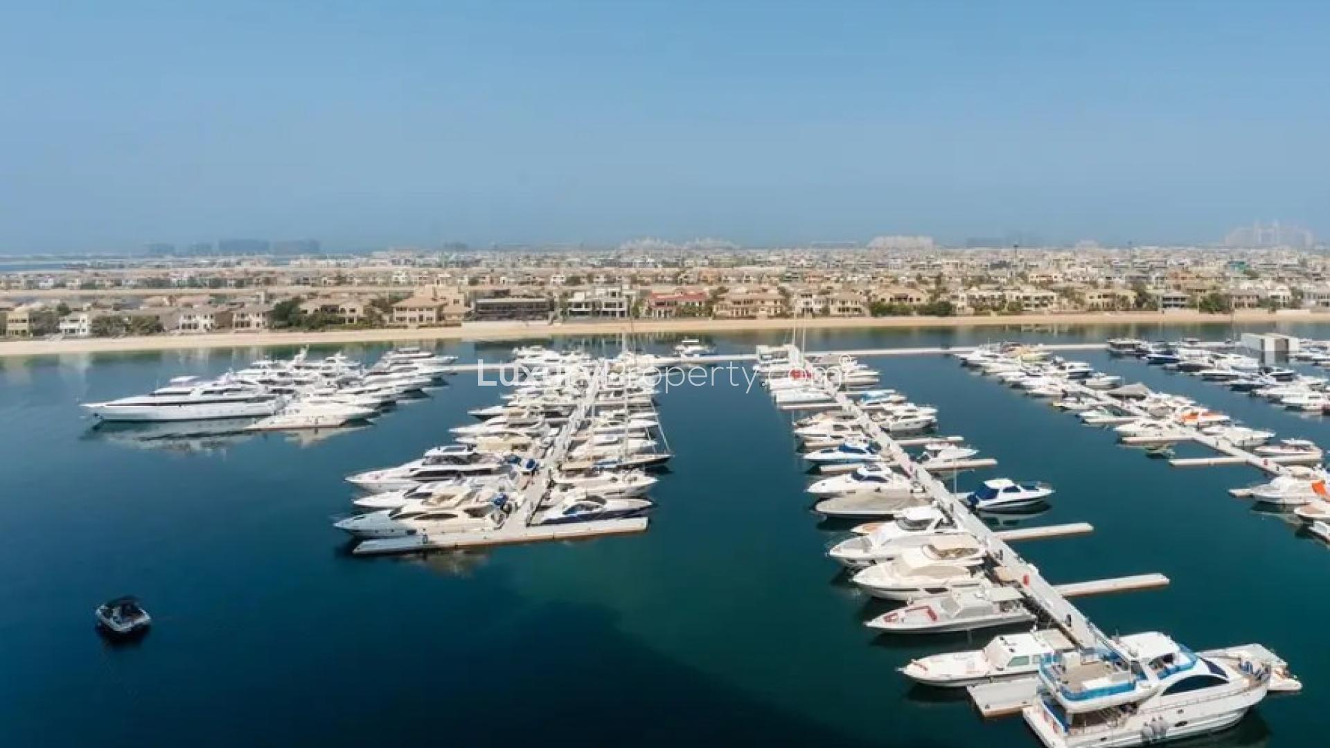 Modern living room in Oceana apartment, Palm Jumeirah, with stylish decor and cozy seating