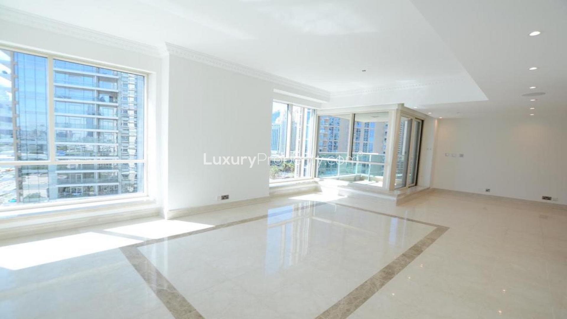 "Balcony view of Dubai Marina from Al Yass Tower apartment in Emaar 6 Towers.",Bright living room with marble floors and marina view in Al Yass Tower, Dubai Marina