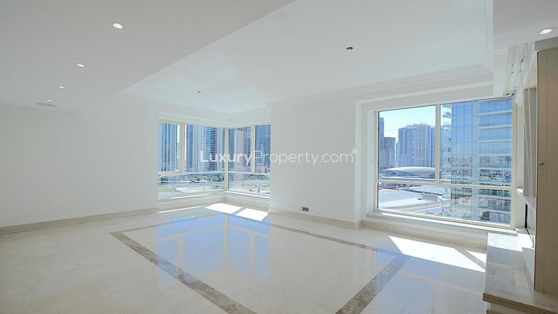 Spacious living area in Al Yass Tower apartment, Dubai Marina, with modern design and lighting