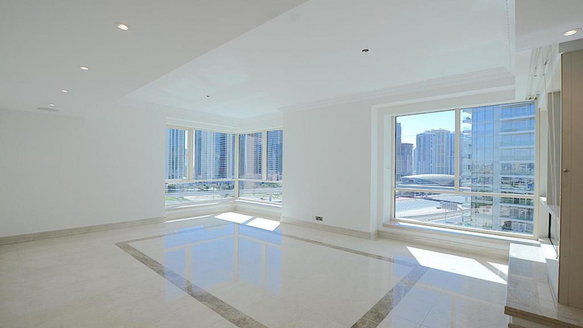 Spacious living area in Al Yass Tower apartment, Dubai Marina, with modern design and lighting