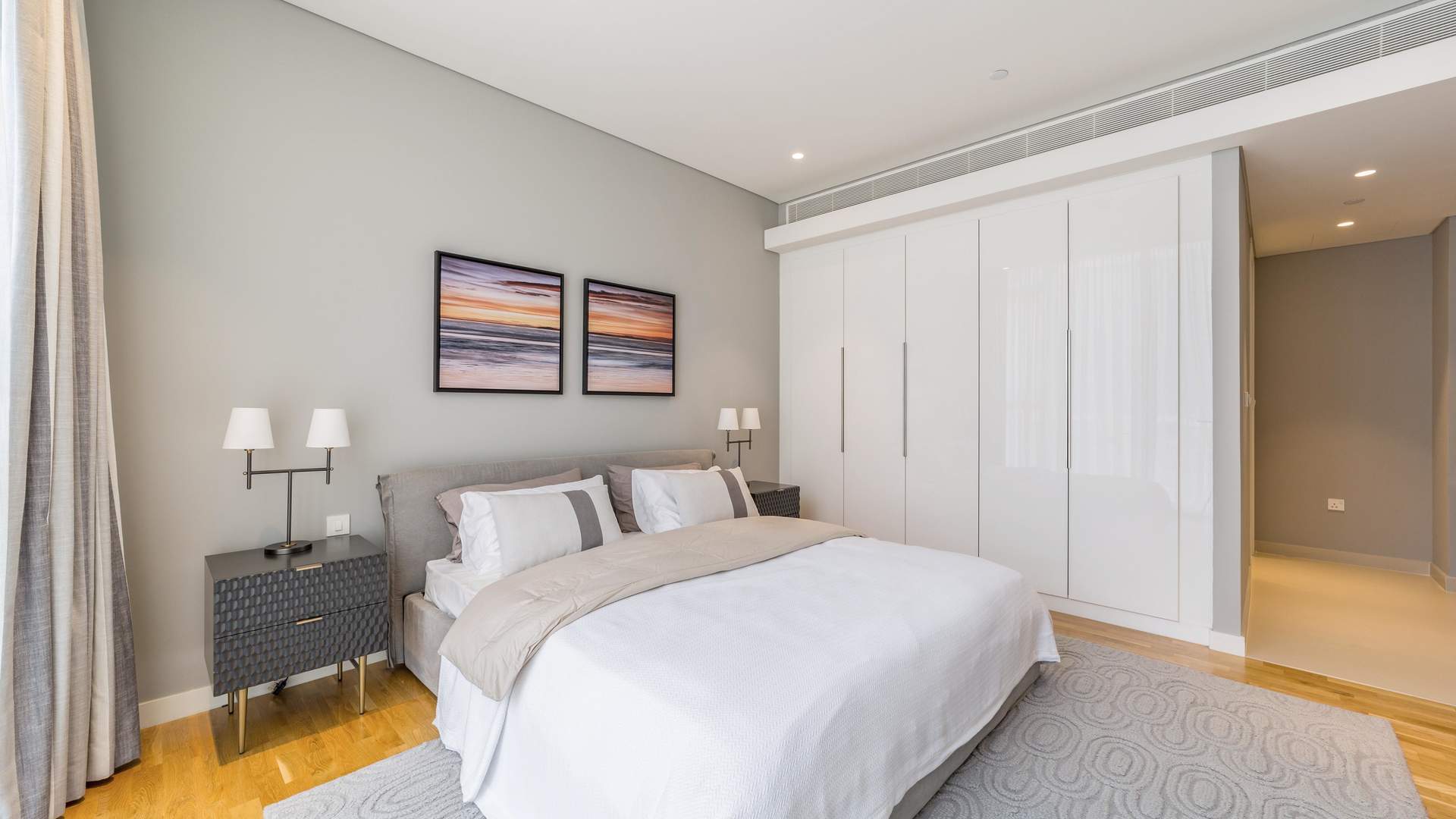 Modern open-plan living area in three-bedroom Bluewaters apartment, featuring stylish dining and kitchen