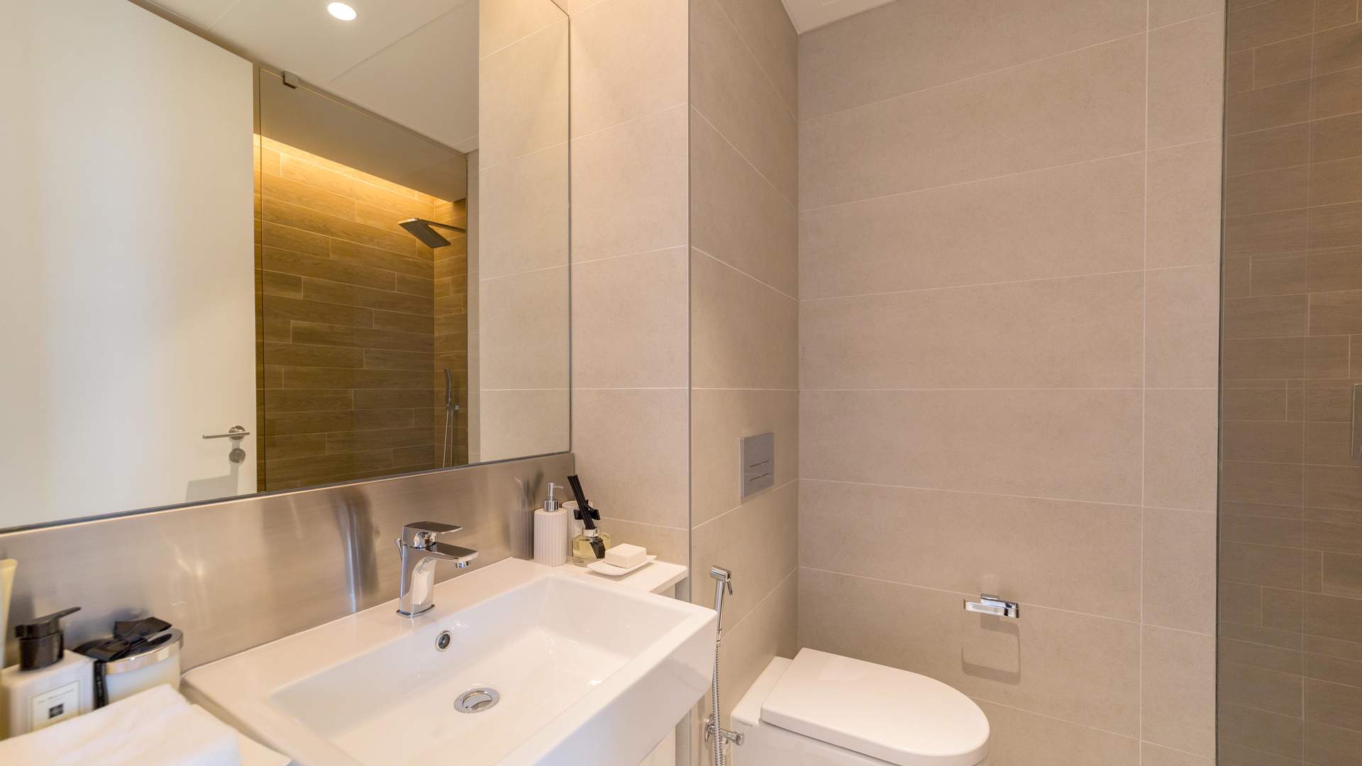 Modern bedroom in Bluewaters three-bedroom apartment, featuring elegant decor and ample natural light