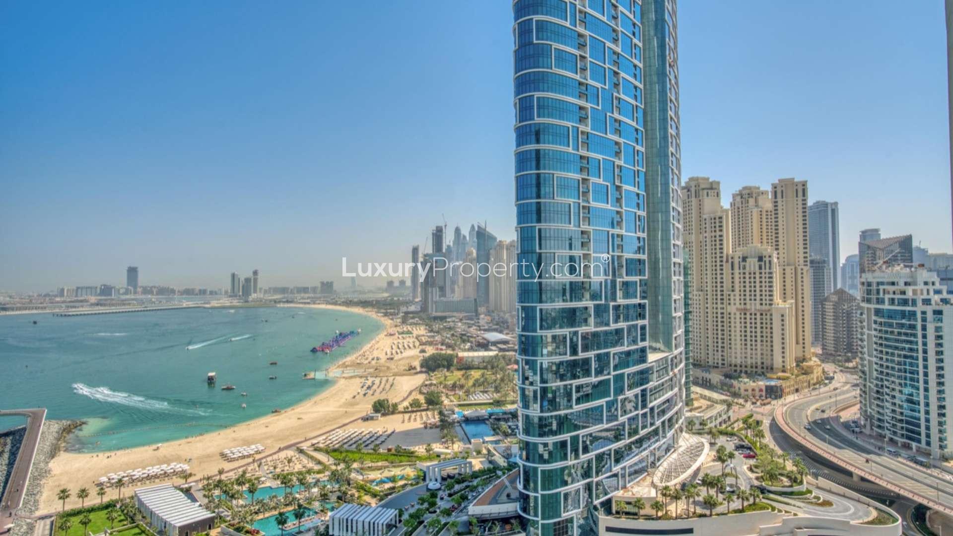 Modern living room in 3-bedroom Bluewaters apartment, featuring stylish furniture and balcony view