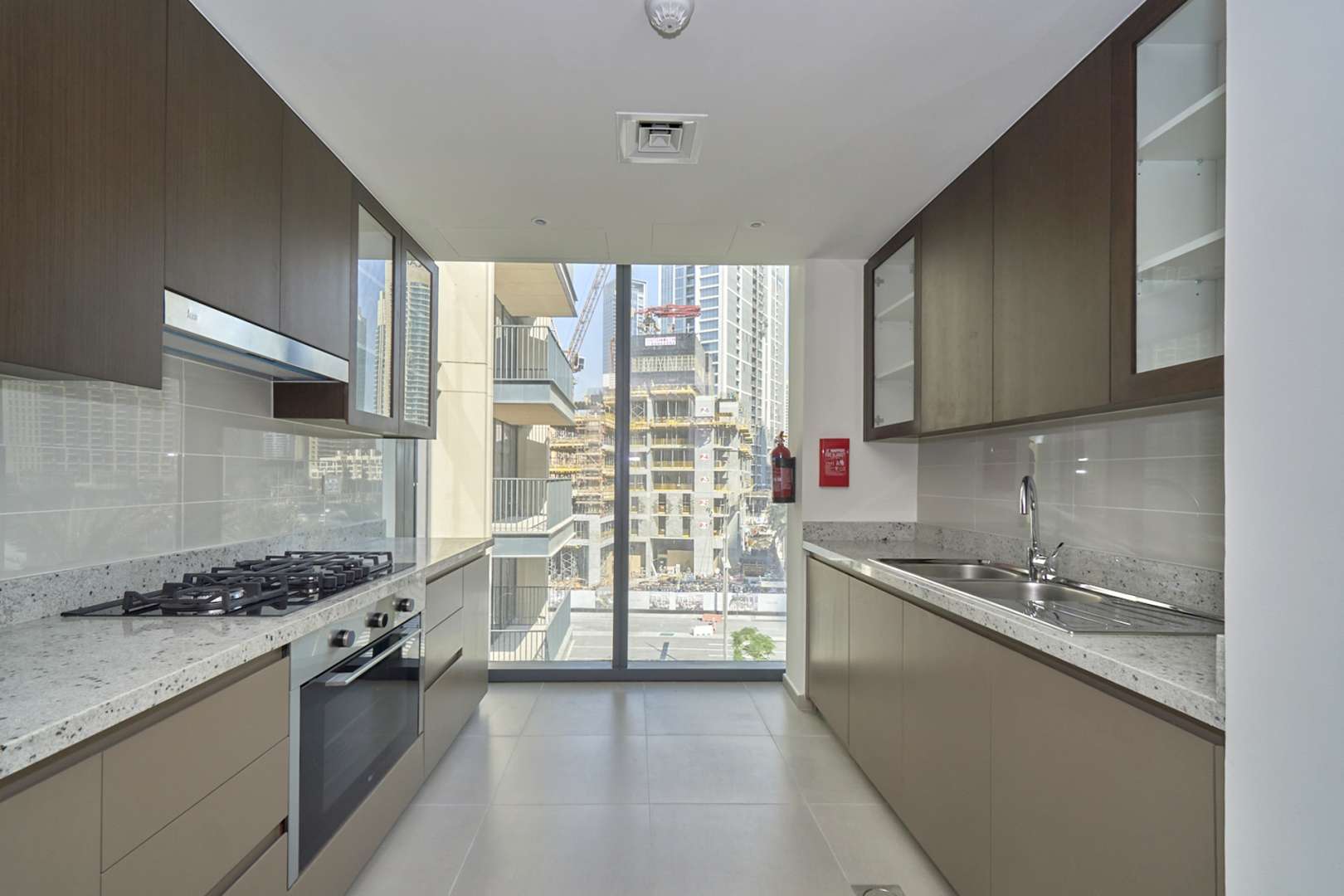 BLVD Heights apartment exterior in Downtown Dubai with palm-lined streets and skyscrapers