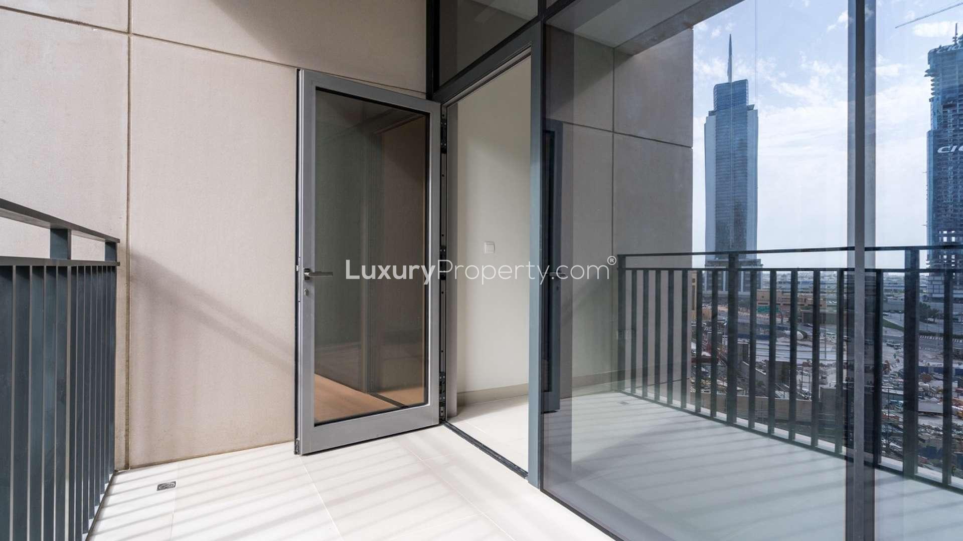 Bright living room with floor-to-ceiling windows in Downtown Dubai apartment for rent