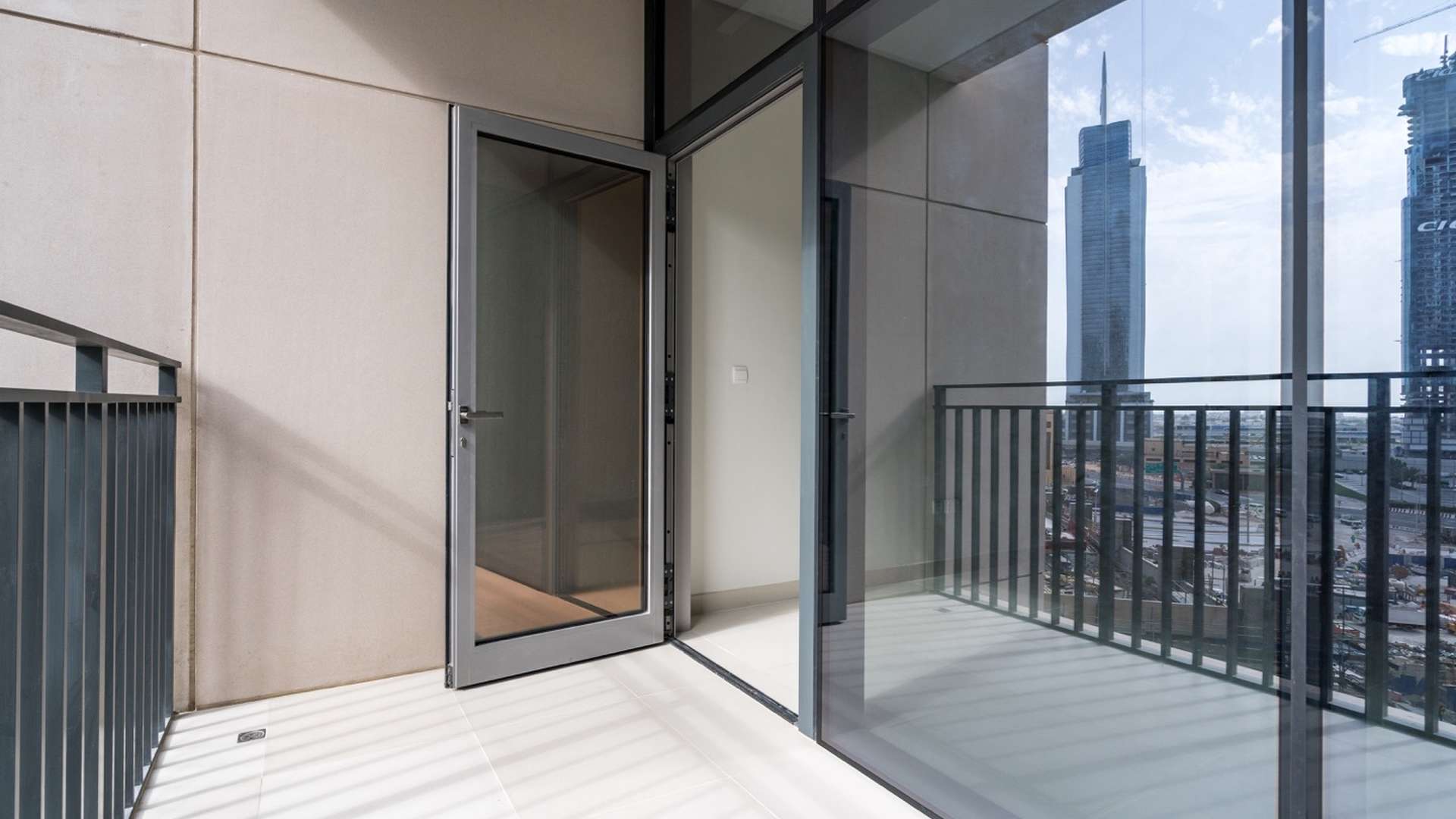 Bright living room with floor-to-ceiling windows in Downtown Dubai apartment for rent