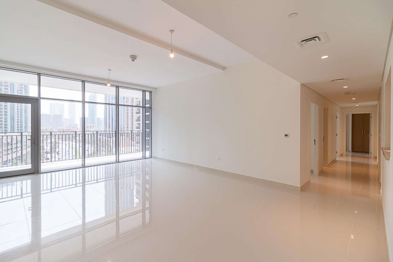 Spacious living room with floor-to-ceiling windows, Downtown Dubai boulevard view, BLVD Crescent apartment